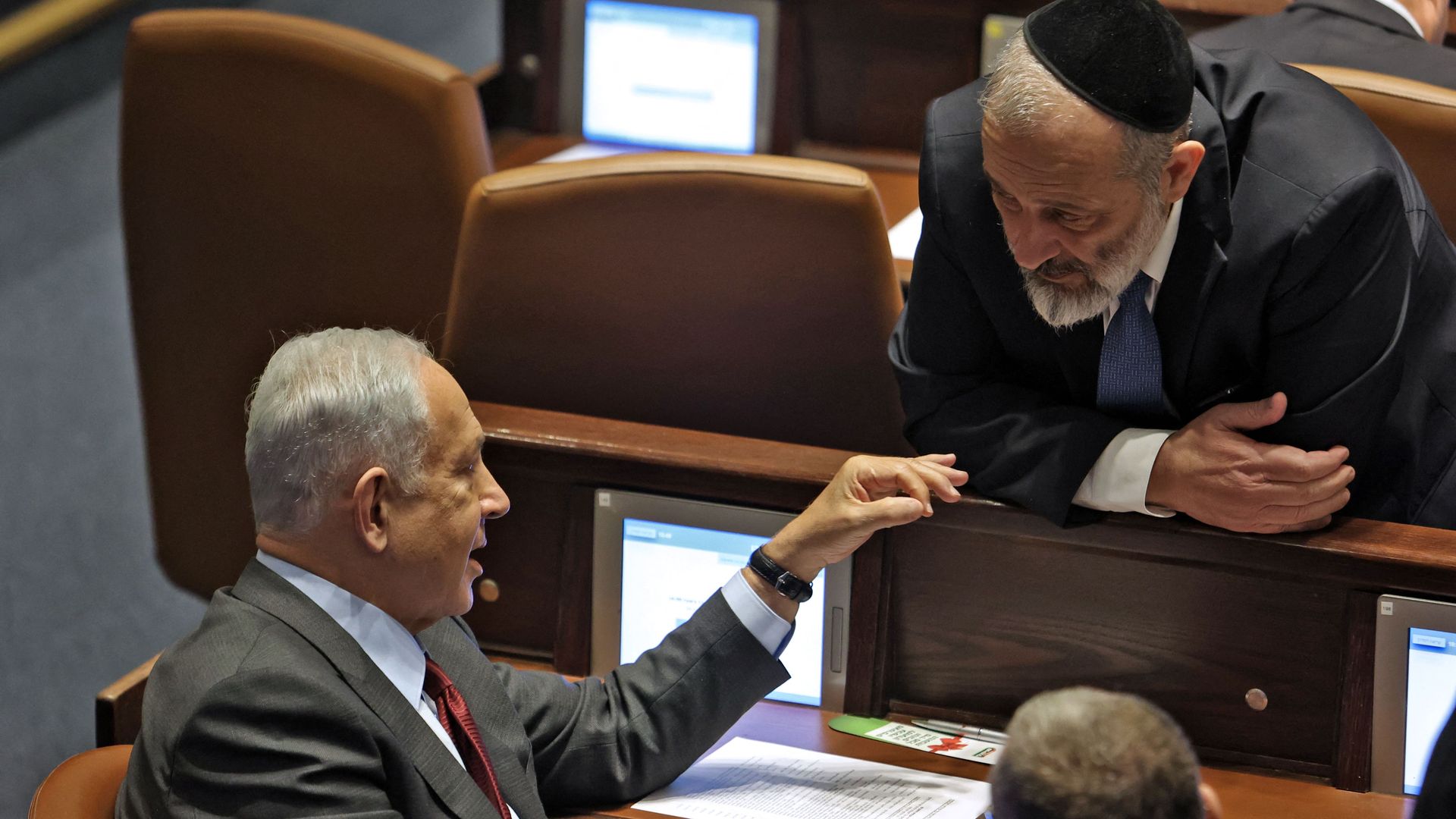 Israeli prime minister-designate Benjamin Netanyahu speaks with Knesset (Israeli parliament) member Aryeh Deri 