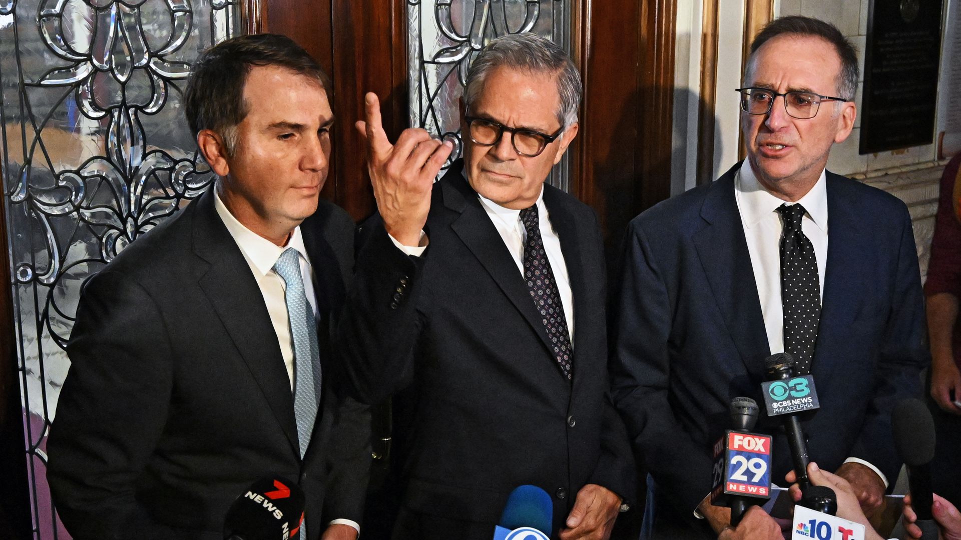 Philadelphia district attorney Larry Krasner, center, after a hearing over a lawsuit he filed against Elon Musk and his $1M giveaway petition contest.