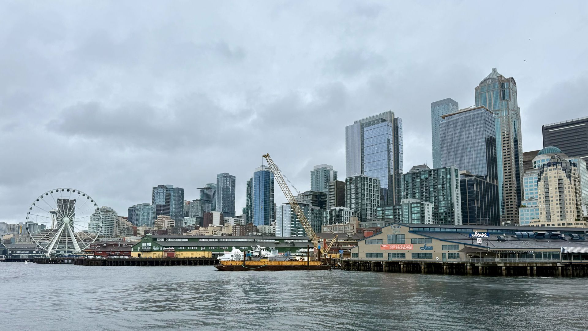 A view of the gray Seattle skyline from Elliott Bay. 