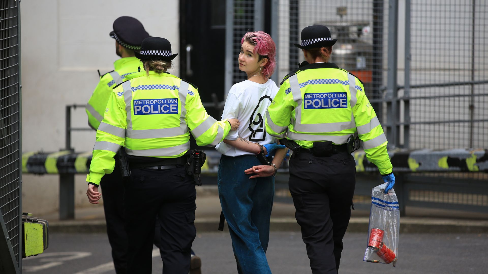 A Just Stop Oil activist is arrested after Van Gogh's sunflowers had soup thrown on it at the National Portrait Gallery on October 14, 2022 in London, England.