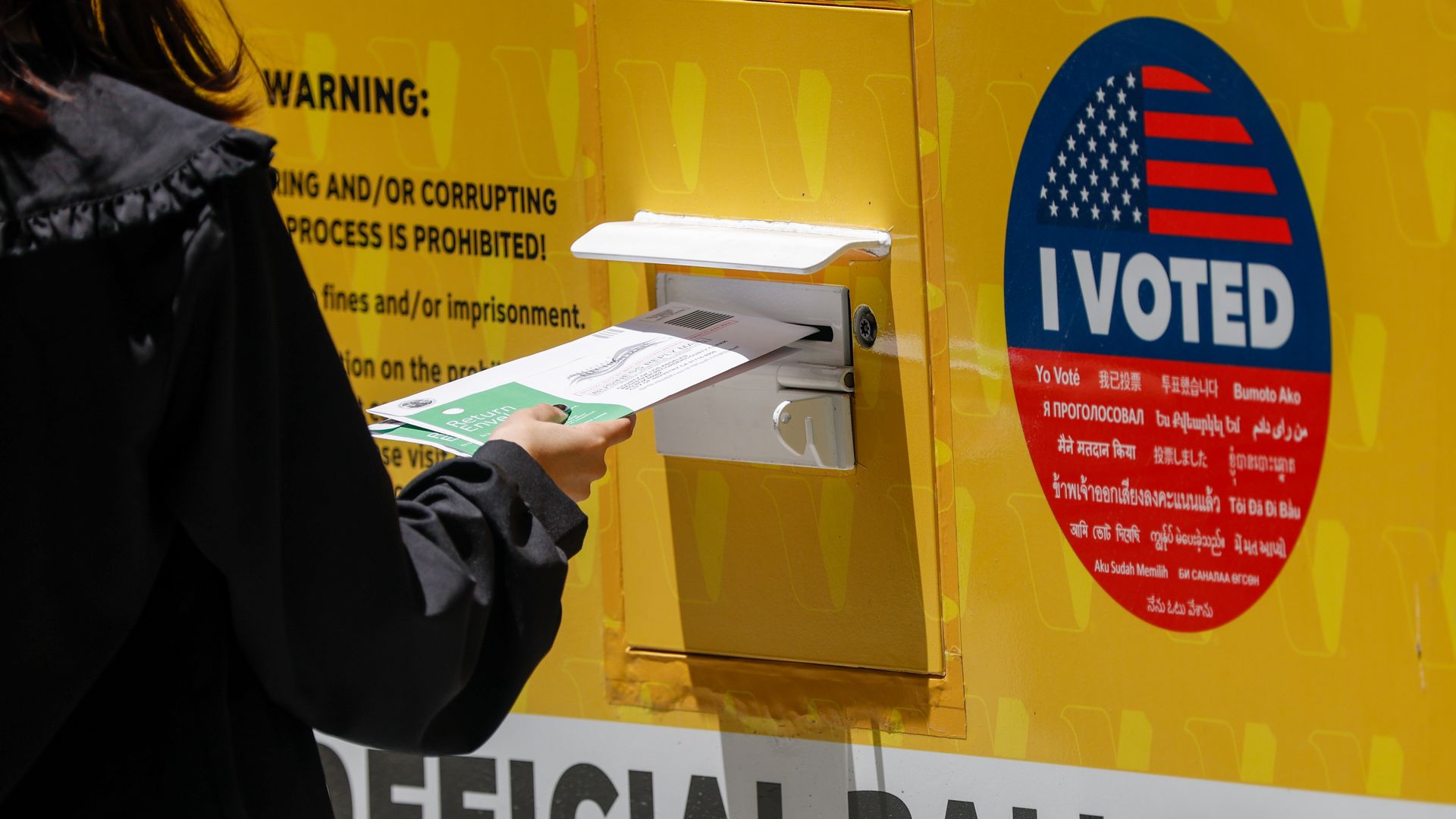 A person places their ballot inside a ballot box during early voting outside of the LA County Registrar-Recorder building on Monday, June 1, 2026 in Norwalk, CA.