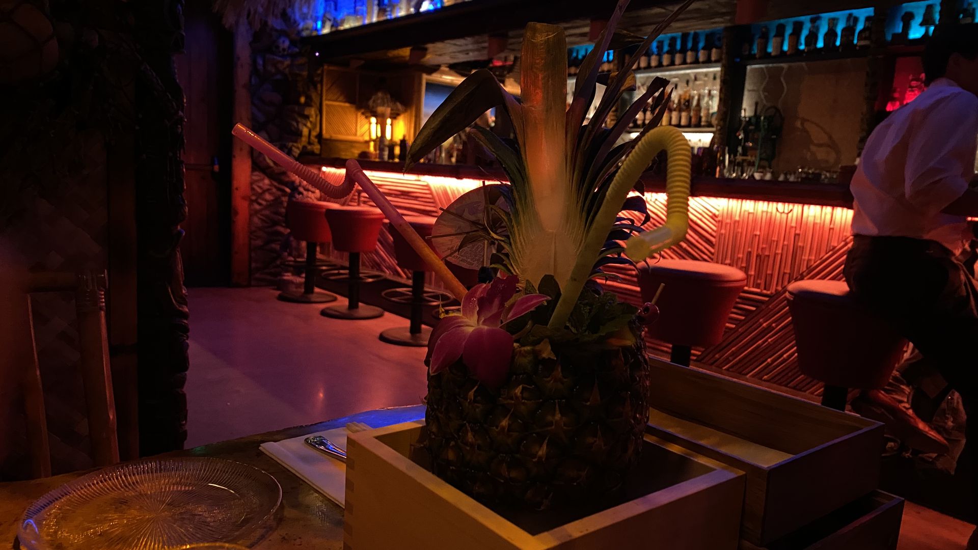 A photo of a drink in a pineapple