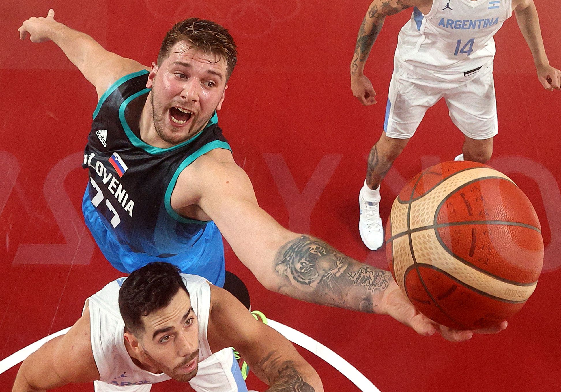 Luka Doncic #77 of Team Slovenia grabs a rebound against Argentina during the first half on day three of the Tokyo 2020 Olympic Games at Saitama Super Arena on July 26, 2021 in Saitama, Japan. 