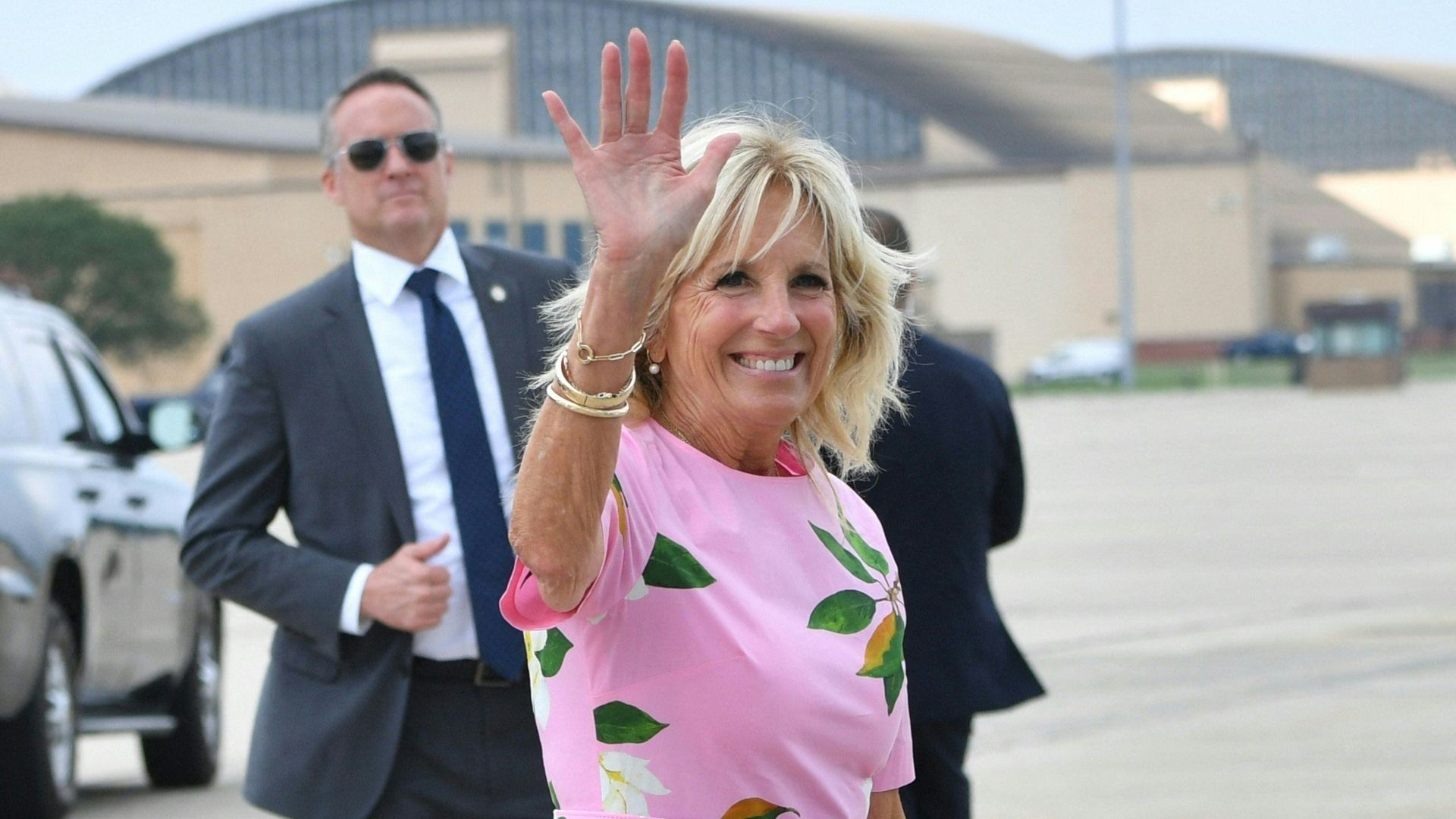 First Lady Jill Biden waves before boarding Air Force One to depart Joint Base Andrews in Maryland on August 10.