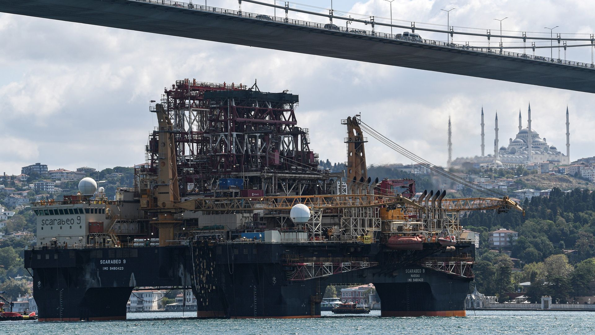 An oil rig sits in the water.