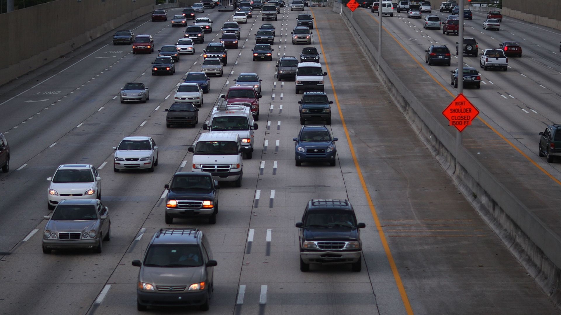Cars driving down interstate.