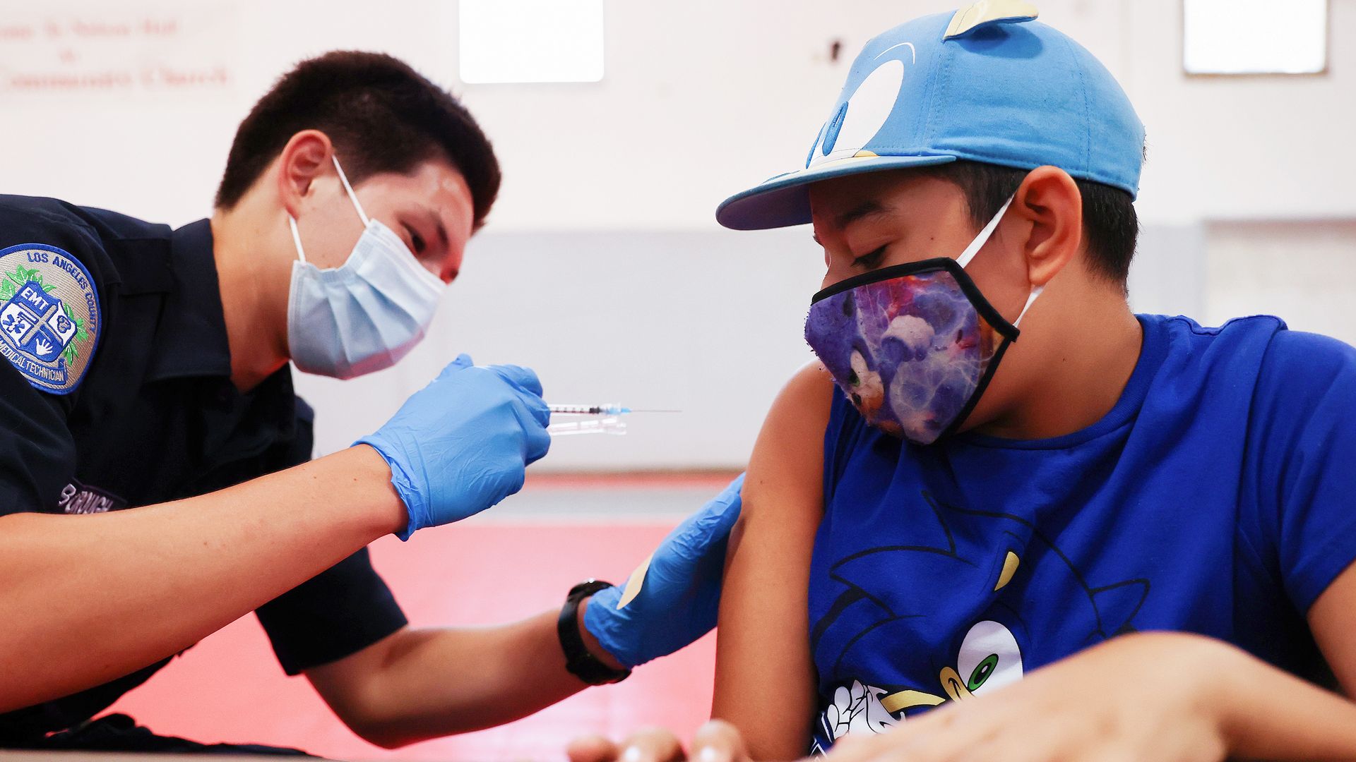 An EMT administering a dose of coronavirus vaccine to a student in Winnetka, California, on July 6.