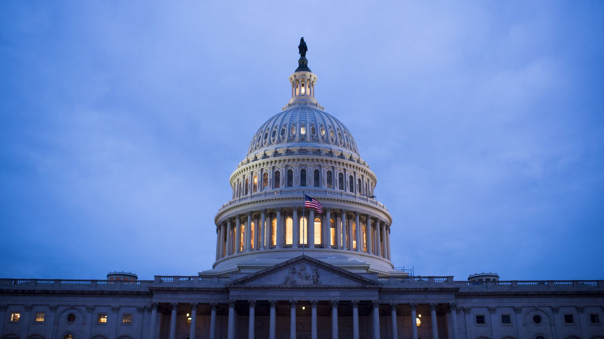 The Capitol Building in Washington D.C. is lit up at night.