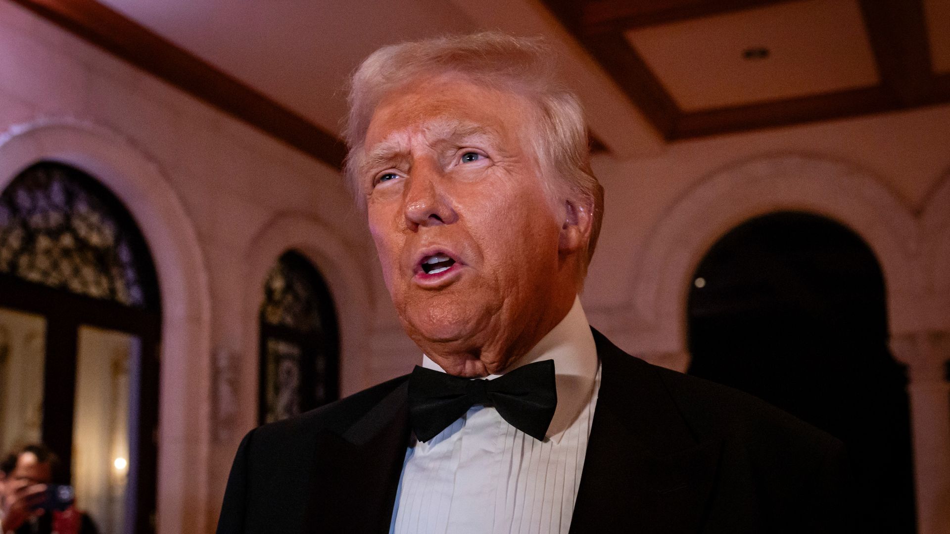 Donald Trump arrives to deliver remarks on New Year's Eve at his Mar-A-Lago Club on December 31