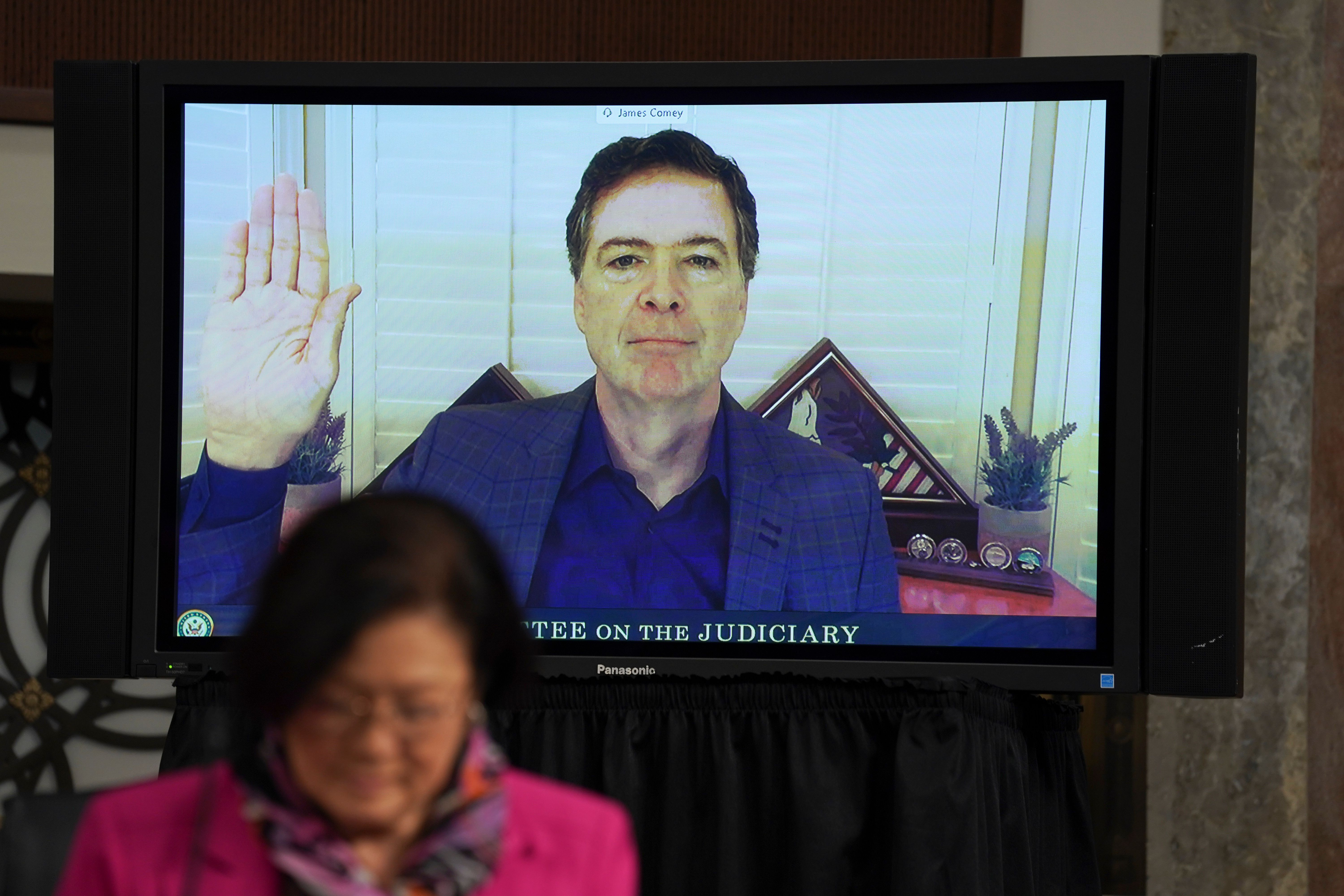 Former FBI director James Comey is sworn in before testifying via videoconference during a Senate Judiciary Committee on Sept. 30, 2020.
