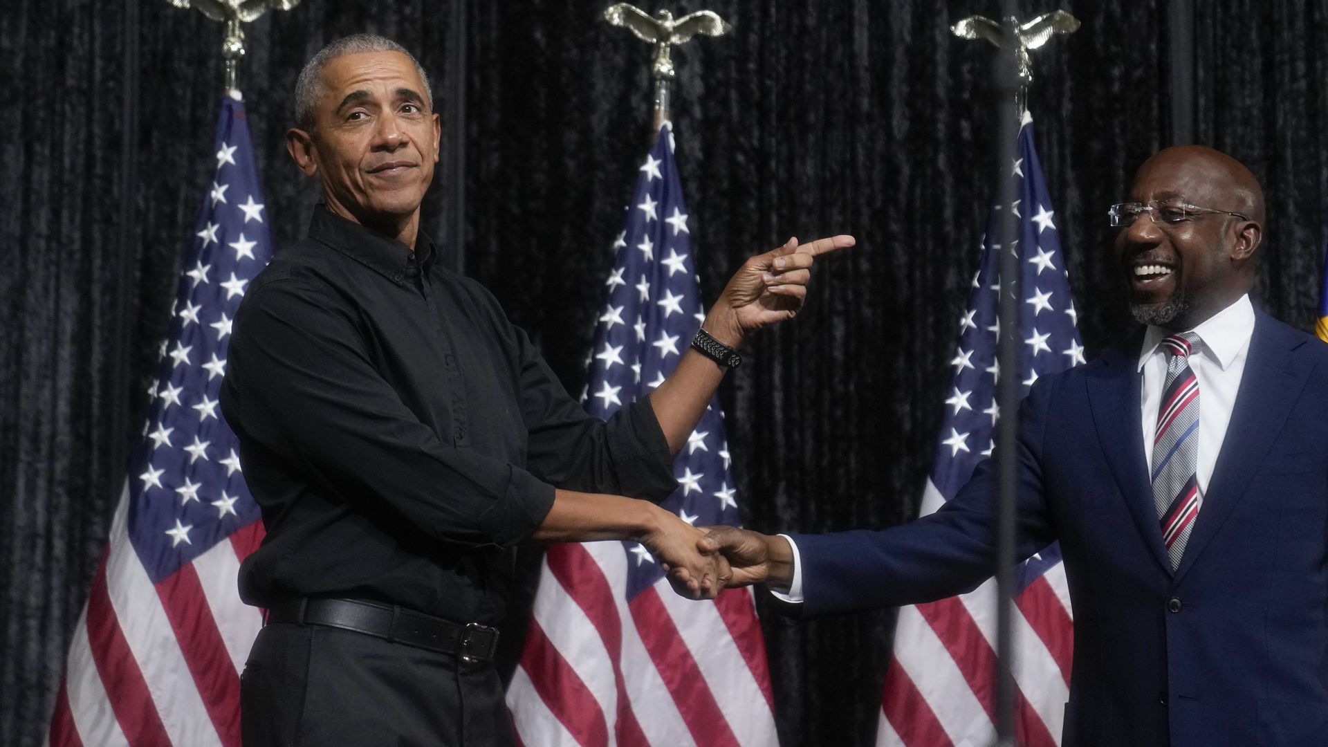 Former President Barack Obama campaigns with Sen. Raphael Warnock in Atlanta on Thursday. 