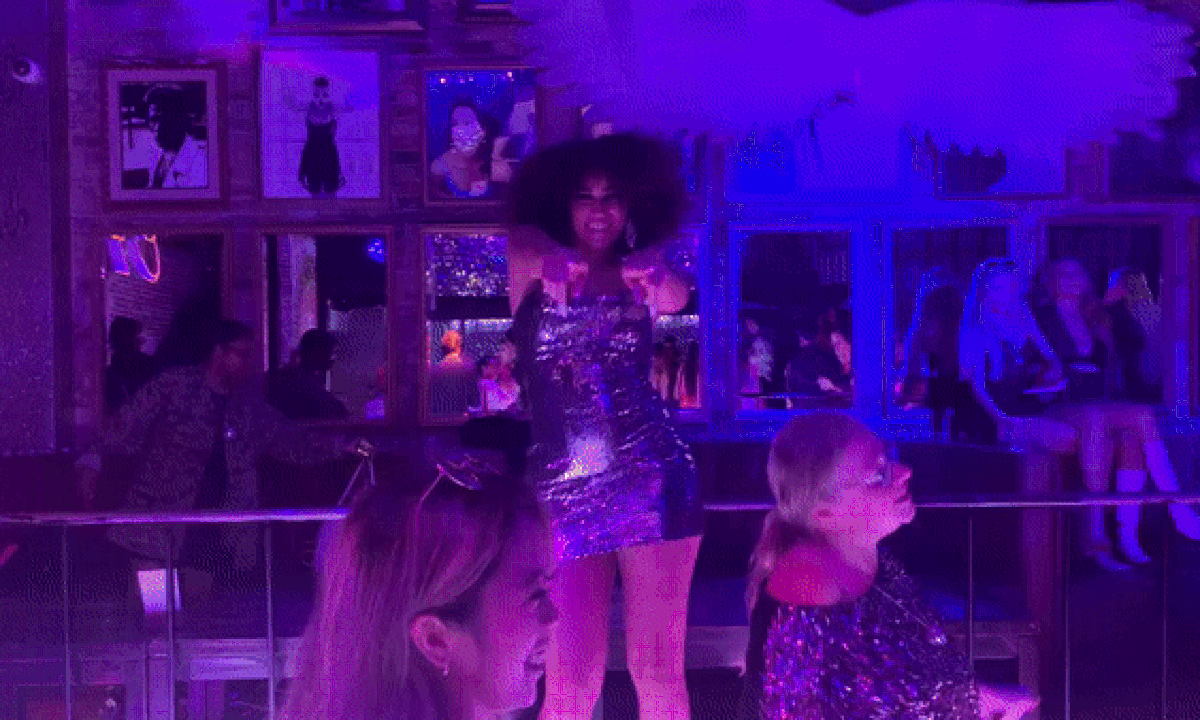 GIF of people dancing in a nightclub. 