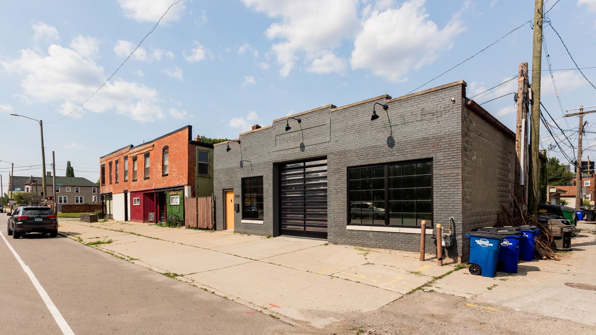A building with a grey facade is shown.
