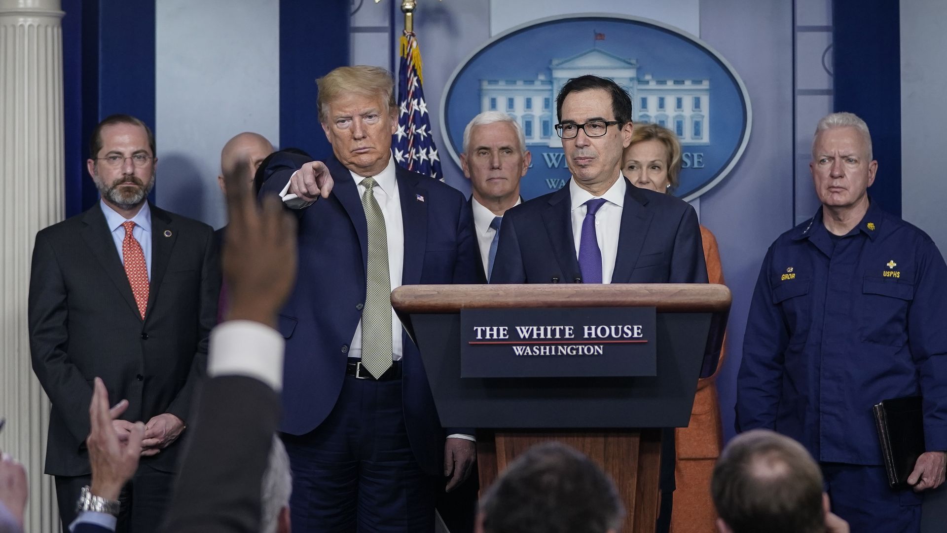 U.S. President Donald Trump and Treasury Secretary Steven Mnuchin, joined by members of the Coronavirus Task Force