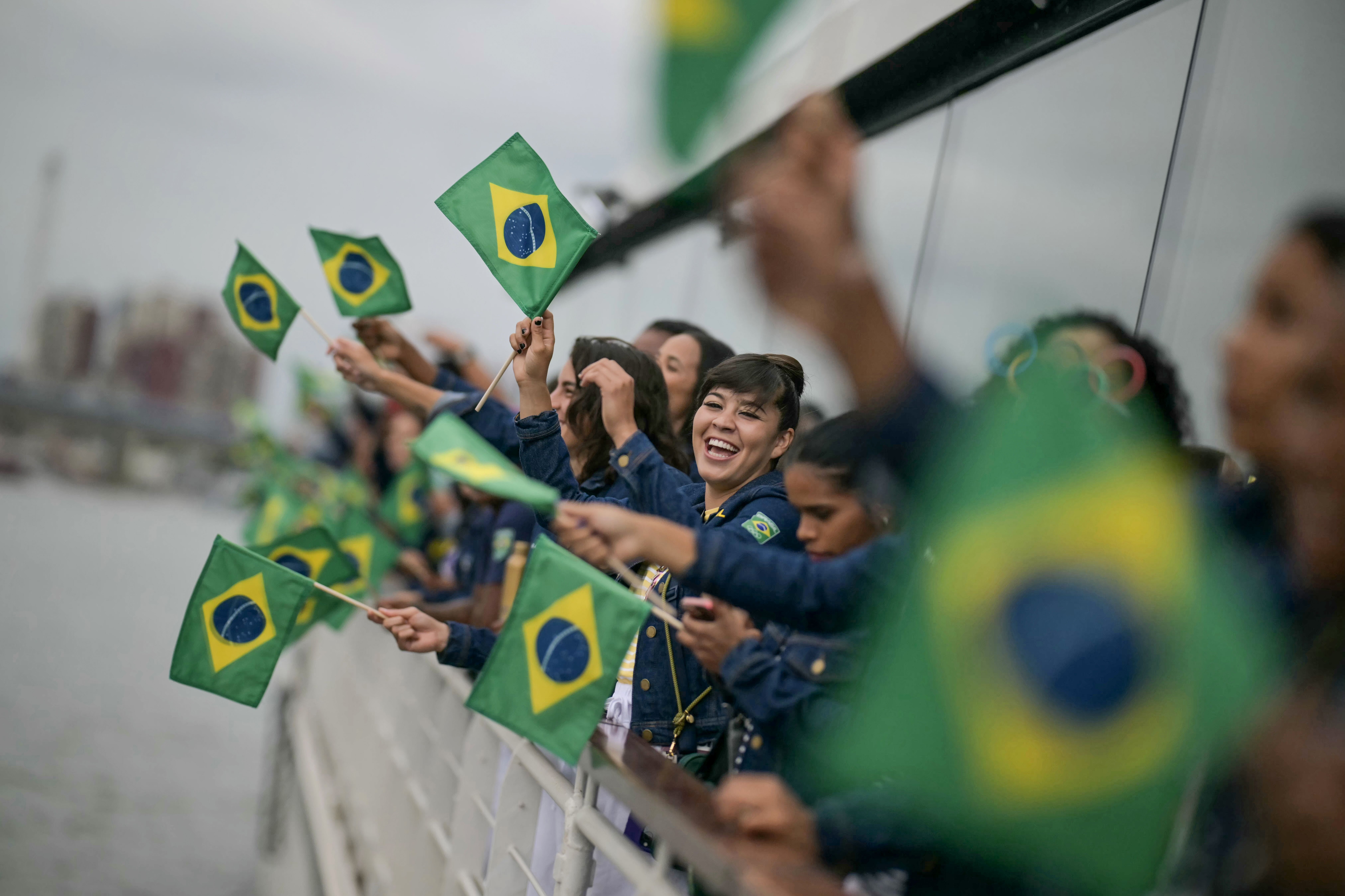 Athletes from the Brazil delegation wave Brazilian flags as they sail in a boat along the river Seine at the start of the Opening Ceremony of the Olympic Games Paris 2024 on July 26, 2024, in Paris, France. (Photo by Carl de Souza - Pool/Getty Images)