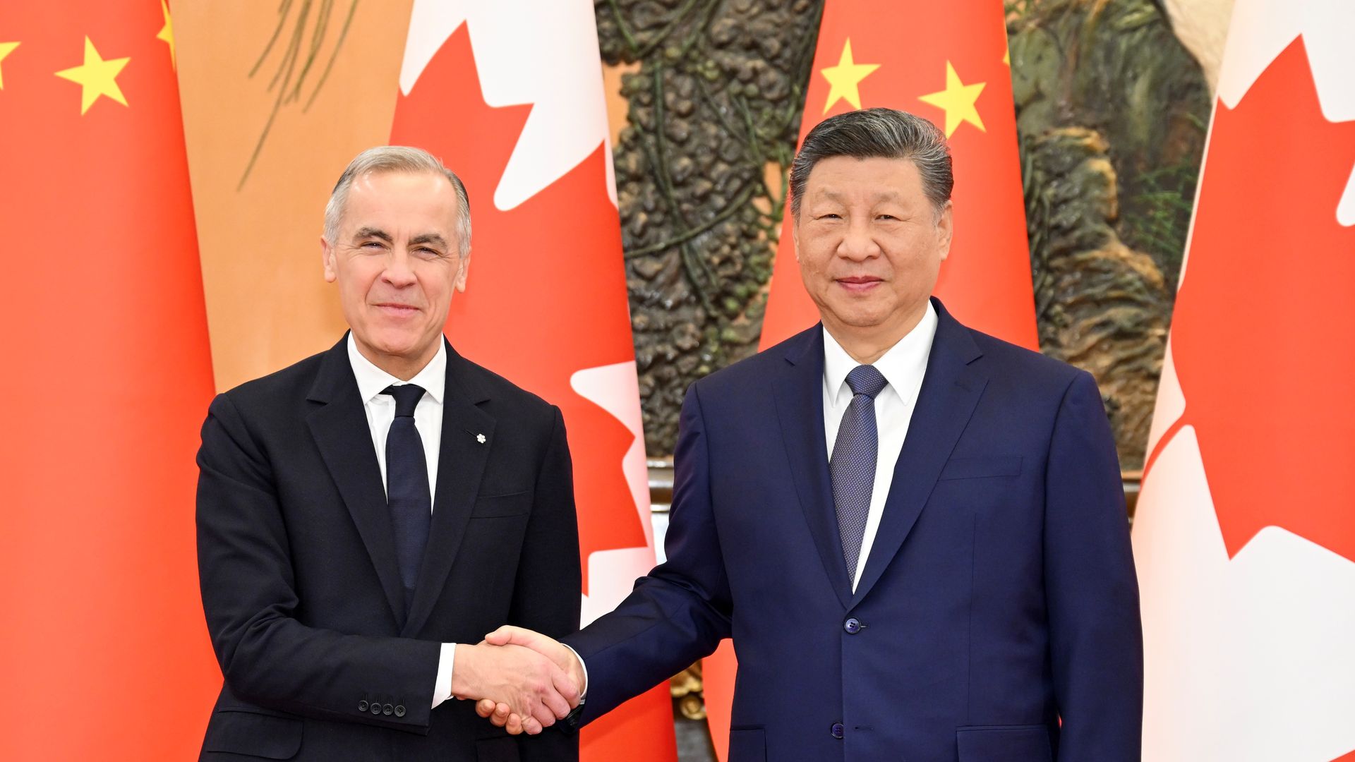Mark Carney and Xi Jinping shake hands 