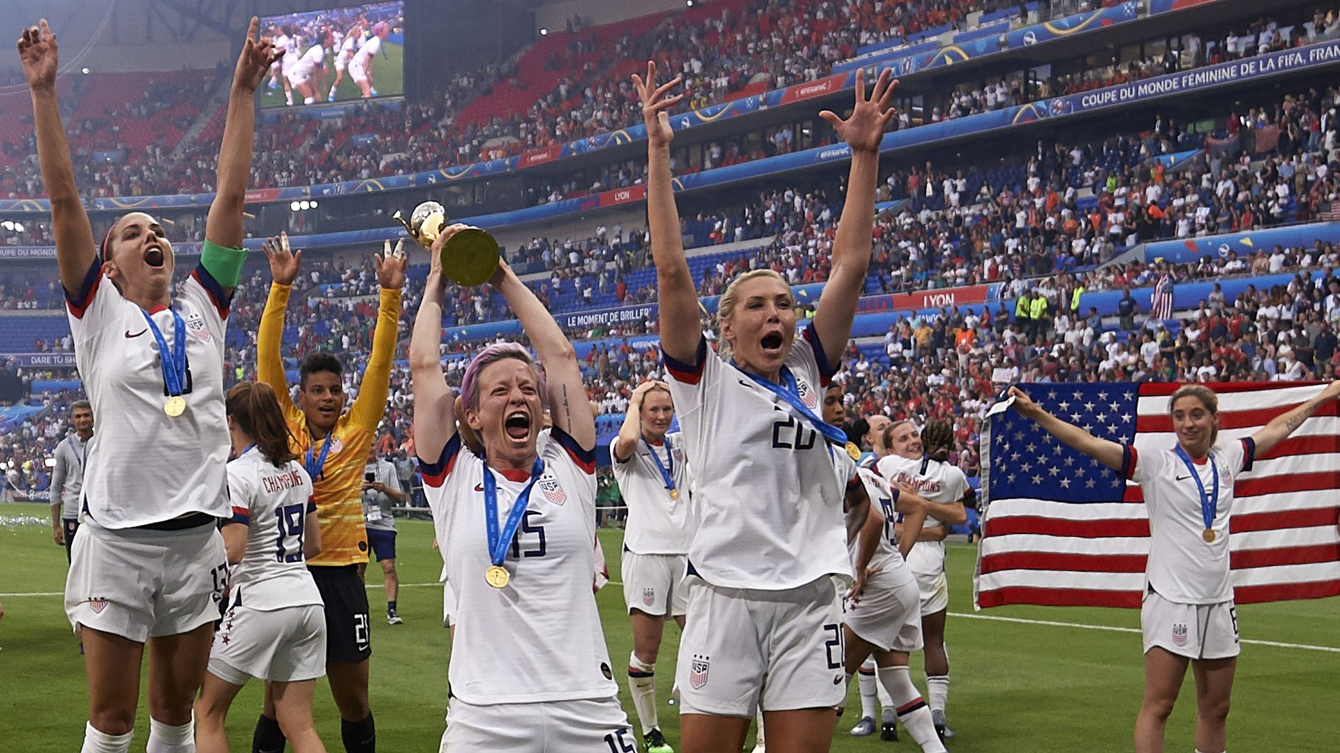  Megan Rapinoe and Alex Morgan of celebrate with their U.S. teammates after winning the 2019 FIFA Women's World Cup France Final at Stade de Lyon on July 7, 2019 in Lyon, France