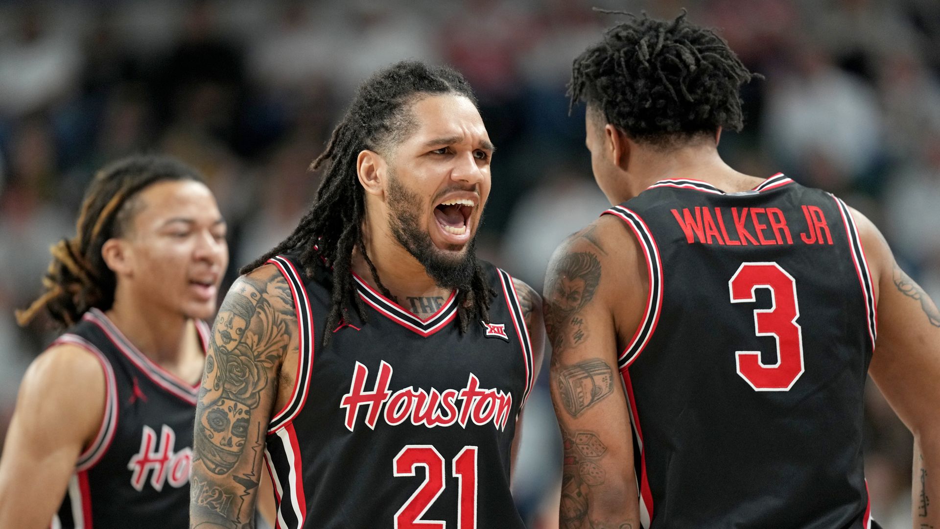 Emanuel Sharp #21 of the Houston Cougars reacts during a game