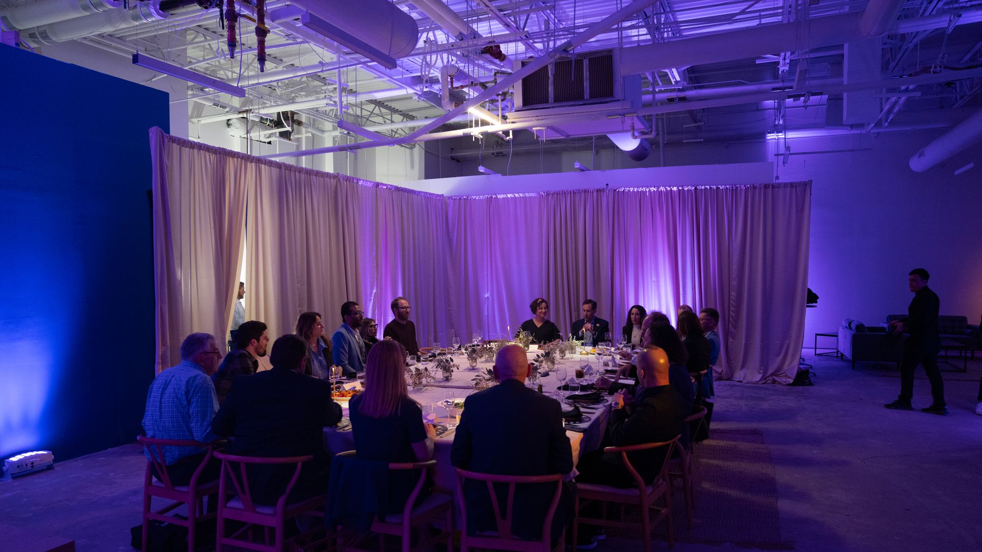 Attendees enjoyed dinner during the discussion: Credit: Cori Baker on behalf of Axios.