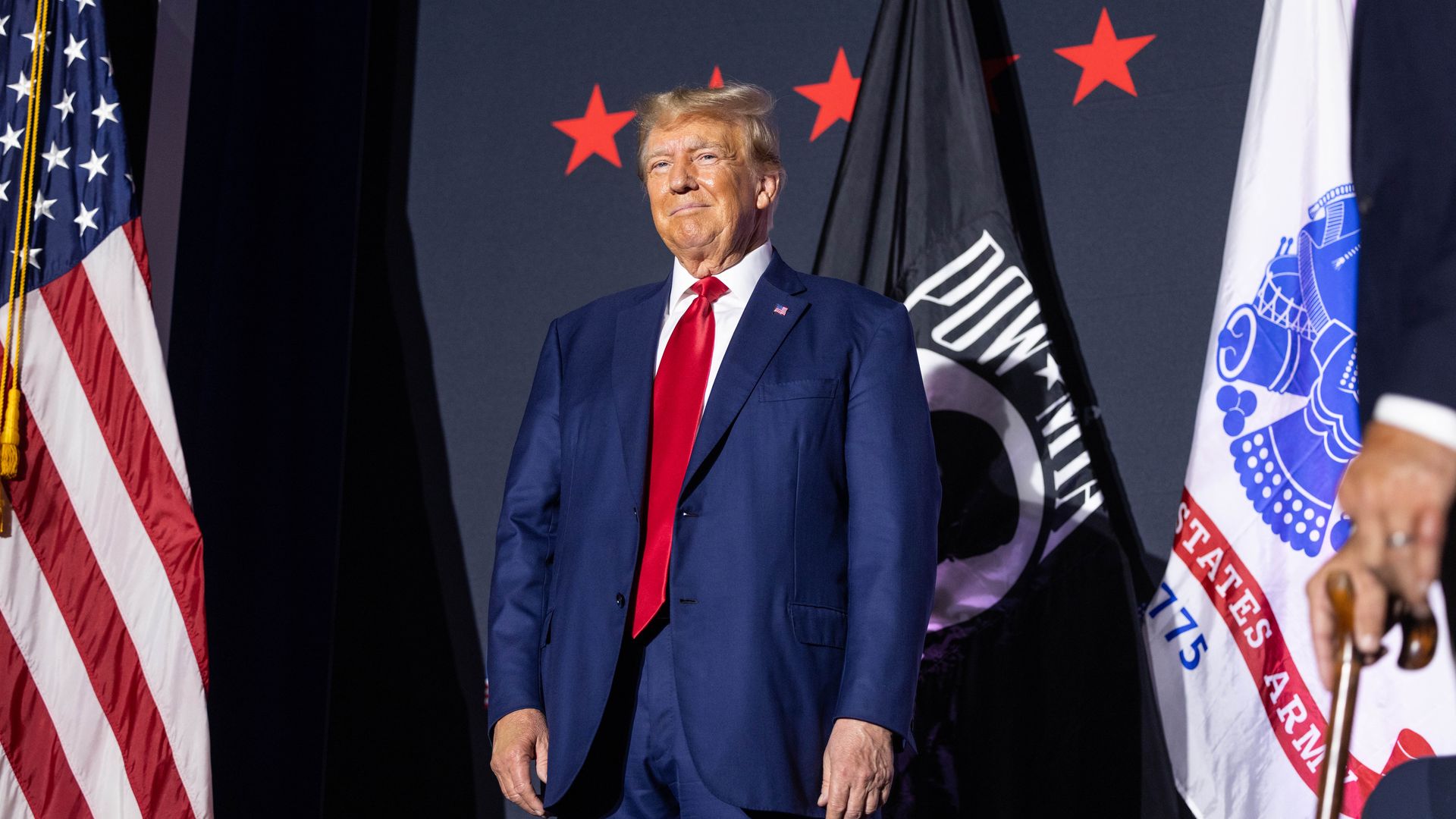 Former U.S. President Donald Trump on stage before delivering remarks at Windham High School on August 8, 2023 in Windham, New Hampshire.