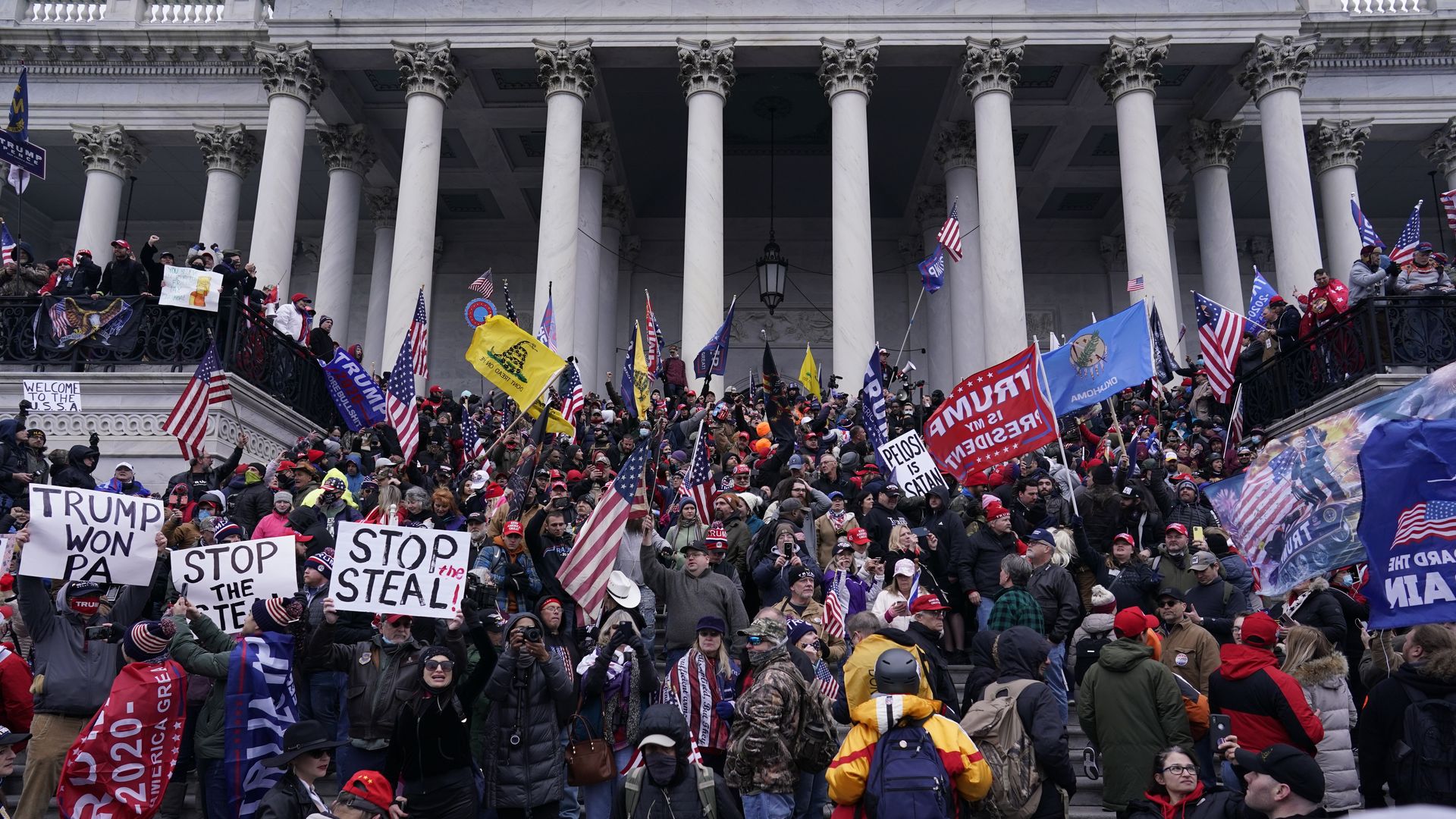 A crowd of Capitol rioters on the steps of the building