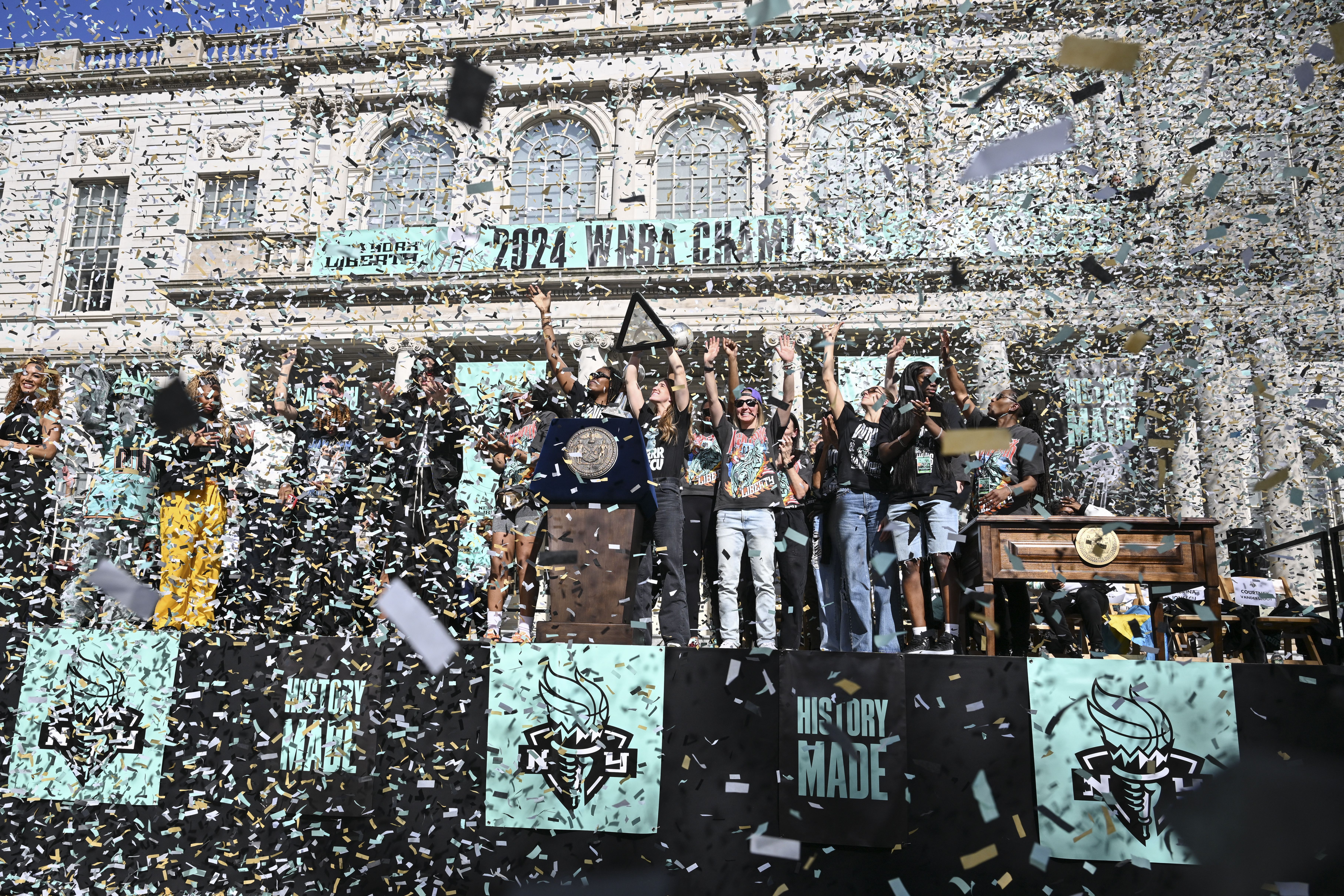 New York Liberty players celebrate their WNBA Championship during a parade in New York City on October 24, 2024. (Photo by ANGELA WEISS / AFP) (Photo by ANGELA WEISS/AFP via Getty Images)