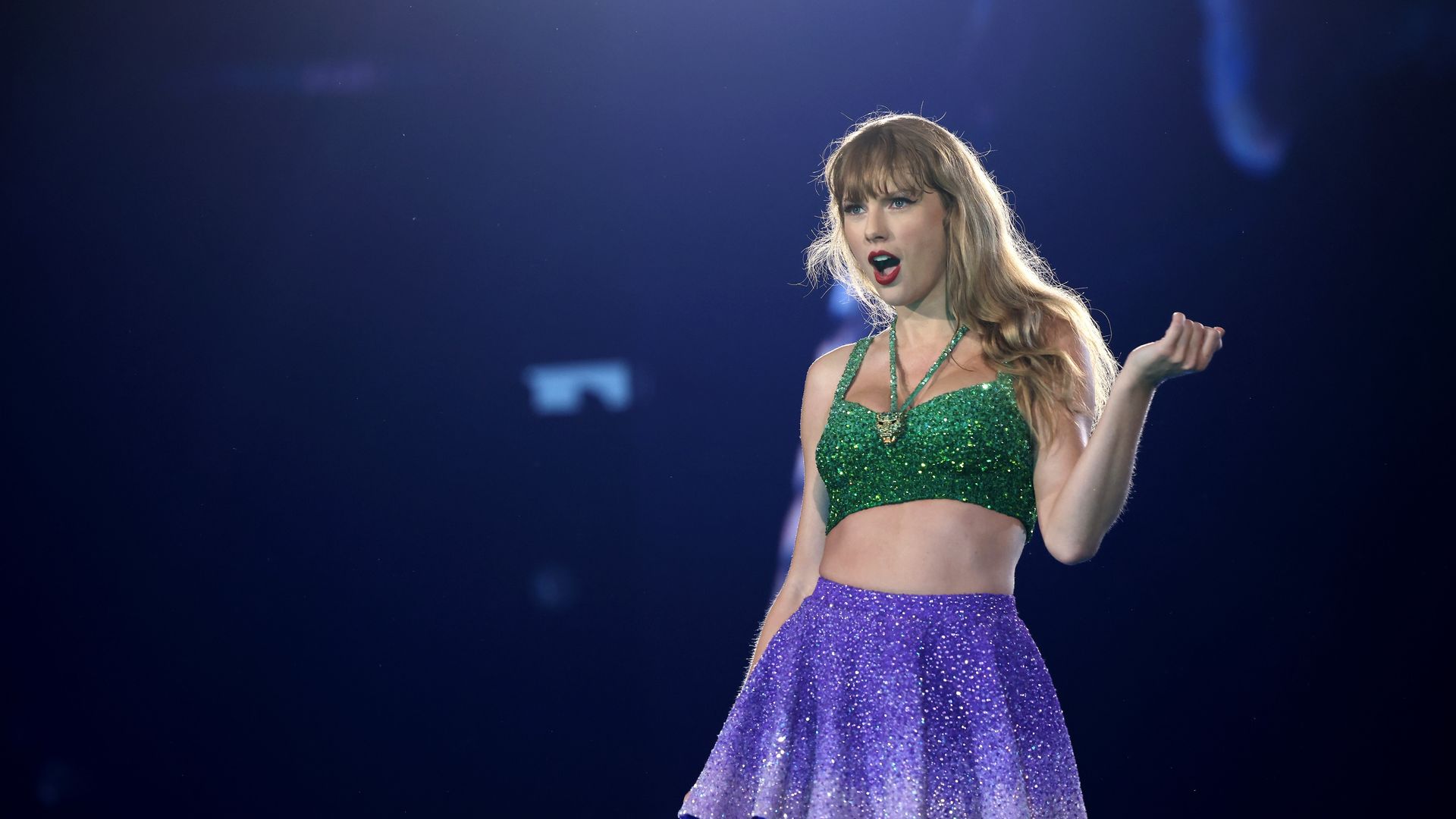 Taylor Swift performs on stage.