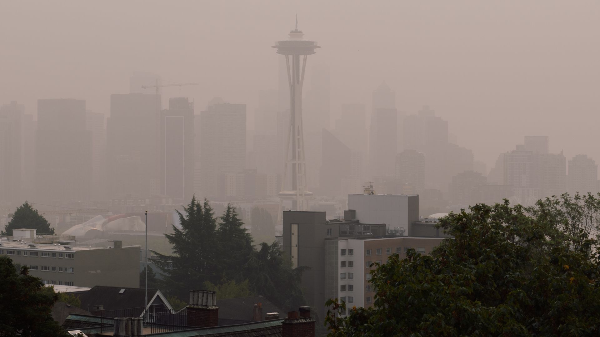 Smoke makes the Seattle skyline hazy, with the Space Needle in the center. 
