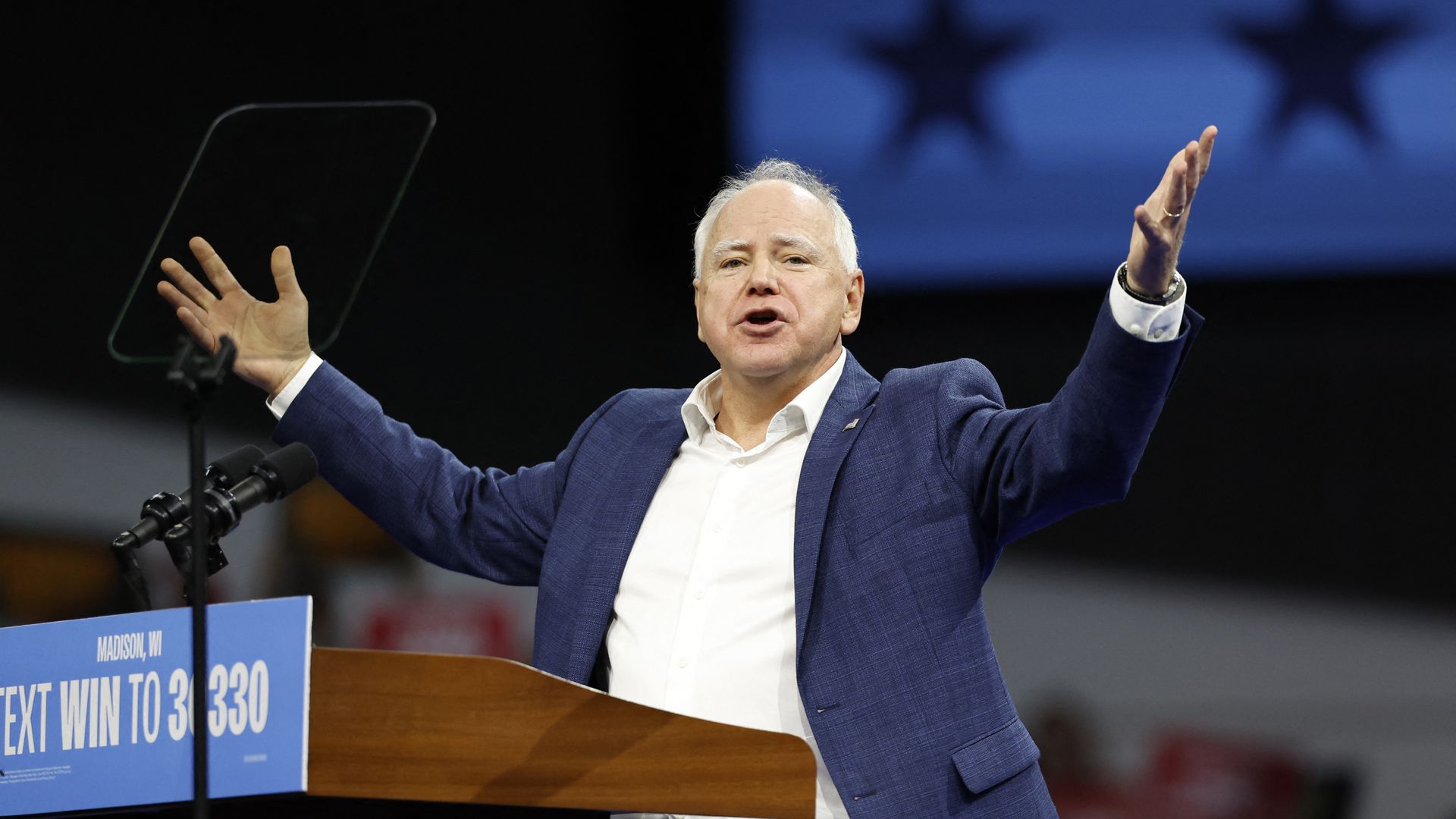 Minnesota Governor and Democratic vice presidential candidate Tim Walz speaks at a campaign rally in support of Vice President and Democratic presidential candidate Kamala Harris at Alliant Center in Madison, Wisconsin, on October 22, 2024. (Photo by KAMIL KRZACZYNSKI / AFP) (Photo by KAMIL KRZACZYN