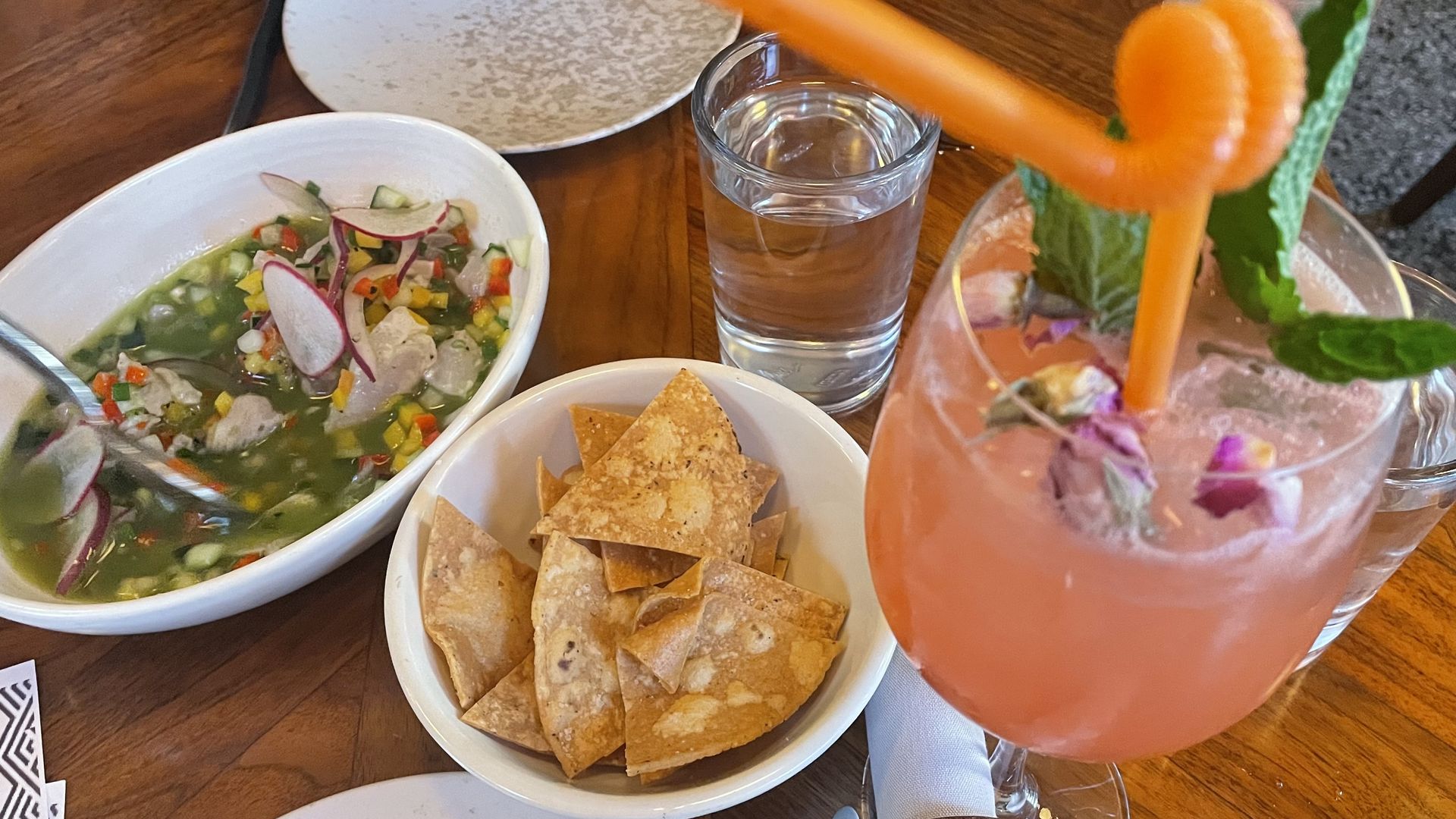 A cocktail, ceviche and chips at Cortez