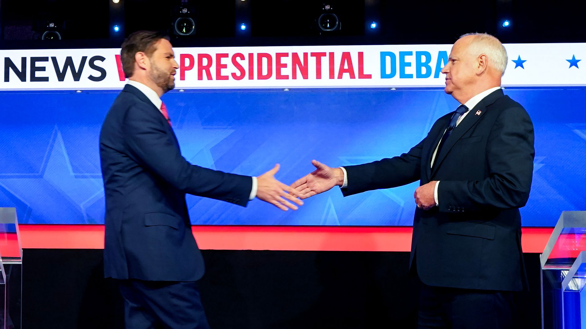 Senator JD Vance, a Republican from Ohio and Republican vice-presidential nominee, left, and Tim Walz, governor of Minnesota and Democratic vice-presidential nominee, shake hands while arriving for during the first vice presidential debate at the CBS Broadcast Center in New York, US, on Tuesday, Oct