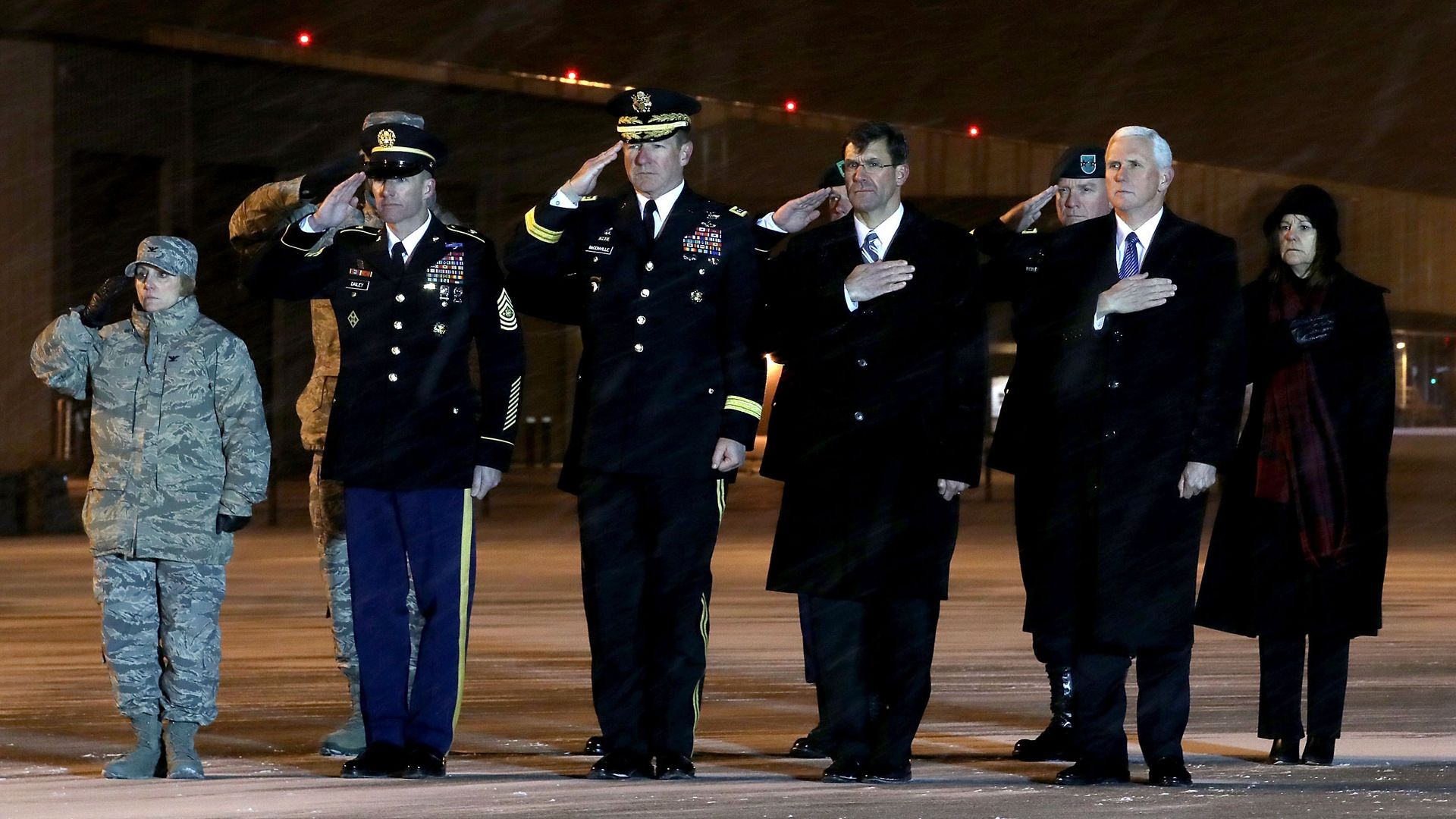 Vice president standing in dover delaware as soldier gets carried away in casket.