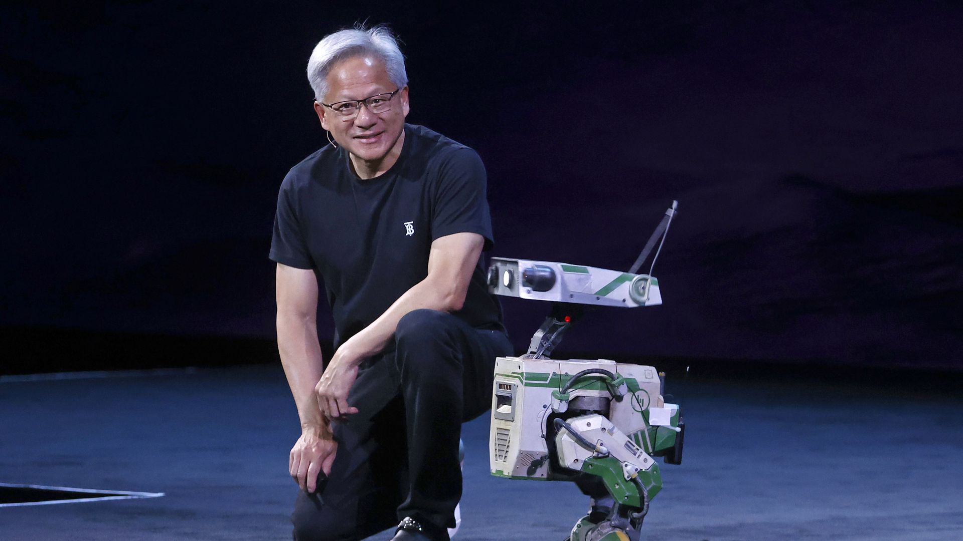   Co-founder and CEO of Nvidia Corp., Jensen Huang poses next to the open foundation model for generalized humanoid robot NVIDIA Isaac GROOT N1 during the 9th edition of the VivaTech show at Parc des Expositions Porte de Versailles on June 11, 2025 in Paris, France. 