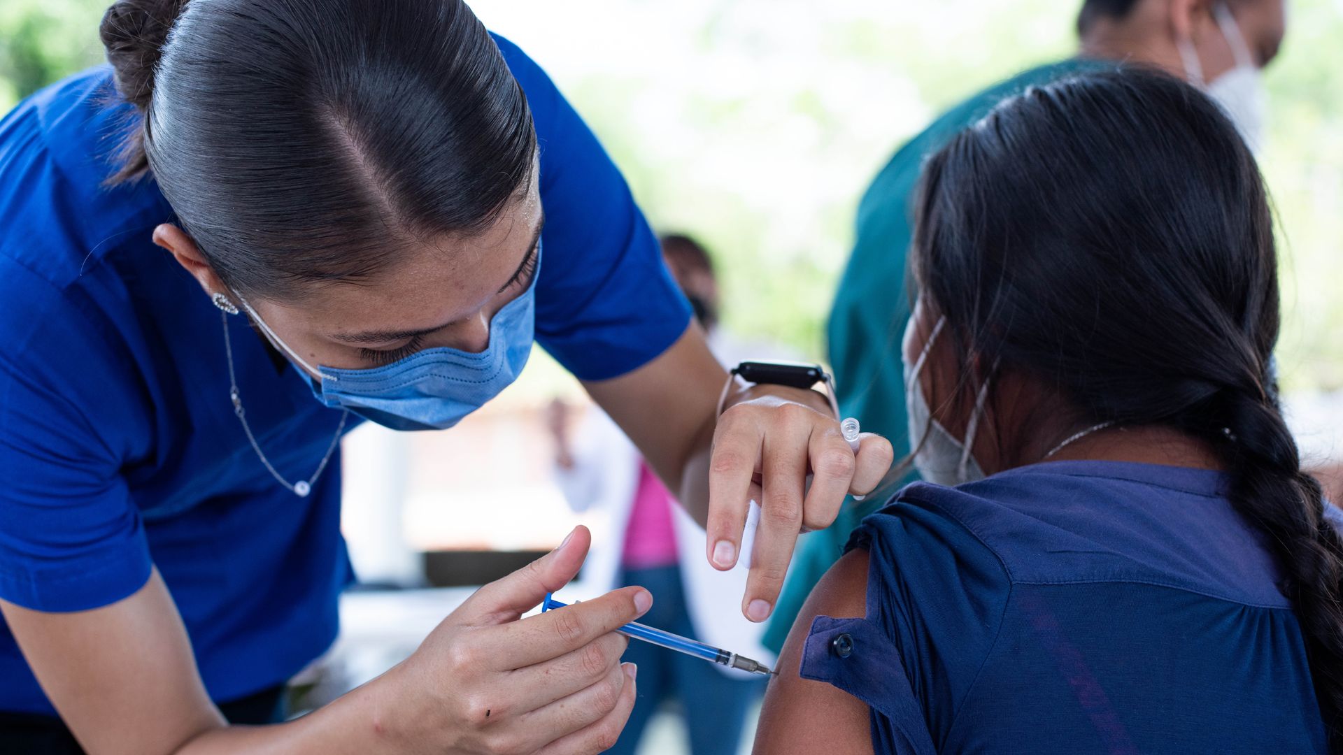A health worker administers a dose of the AstraZeneca vaccine during a vaccination day on August 4, 2021 in Mexico City, Mexico.