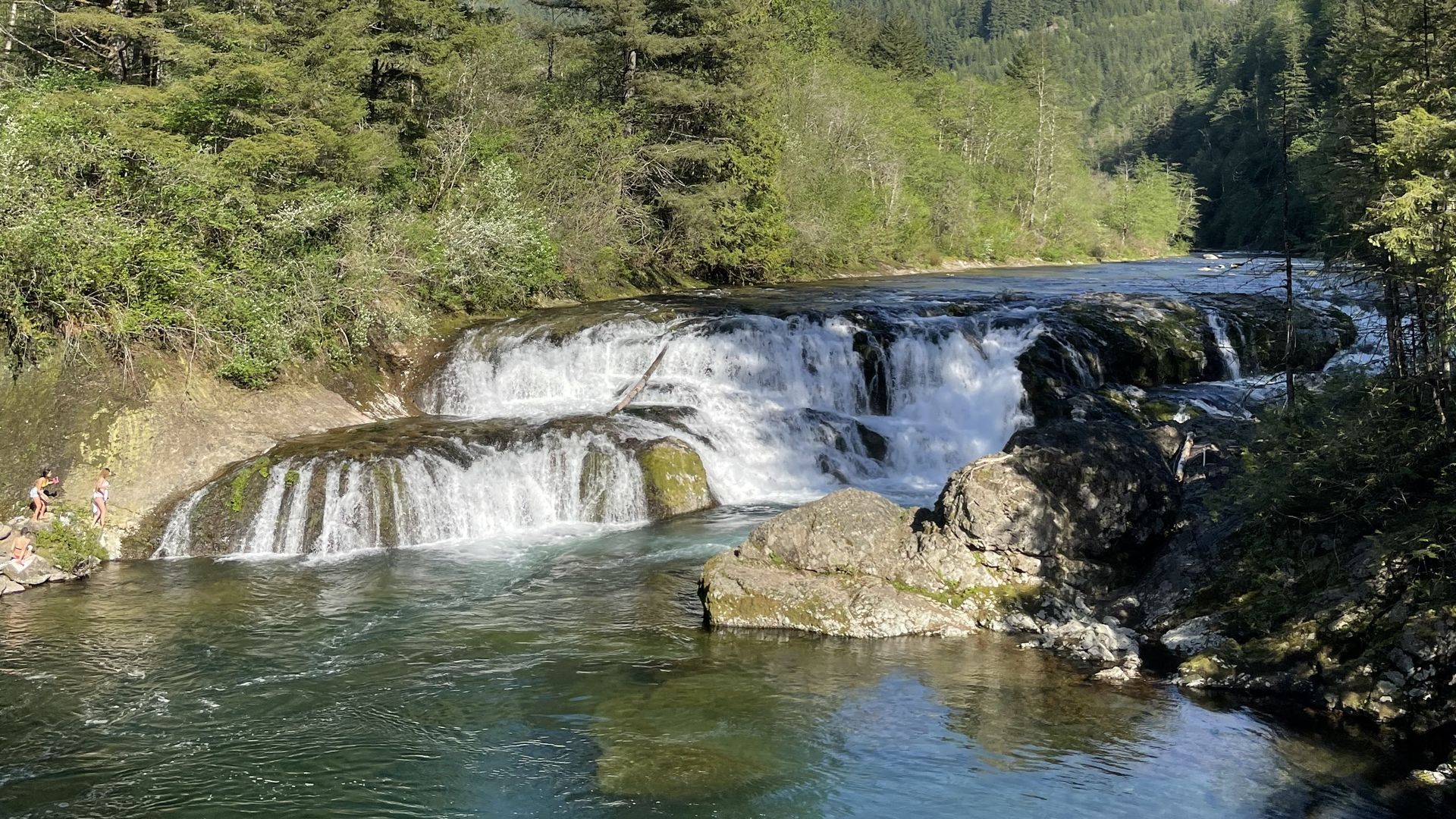 A photo of waterfalls leading into a river.