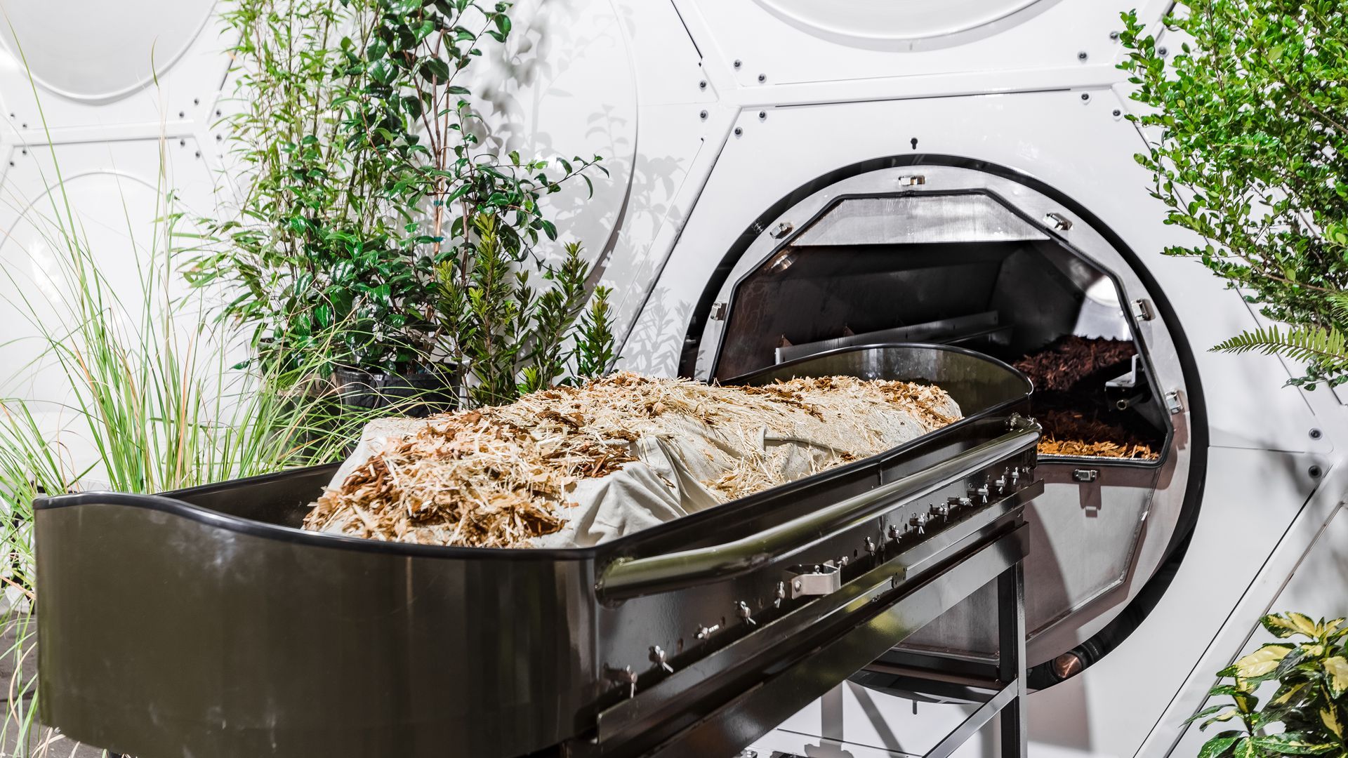 A dummy body in front of a human composting vessel at Recompose’s facility in Washington.