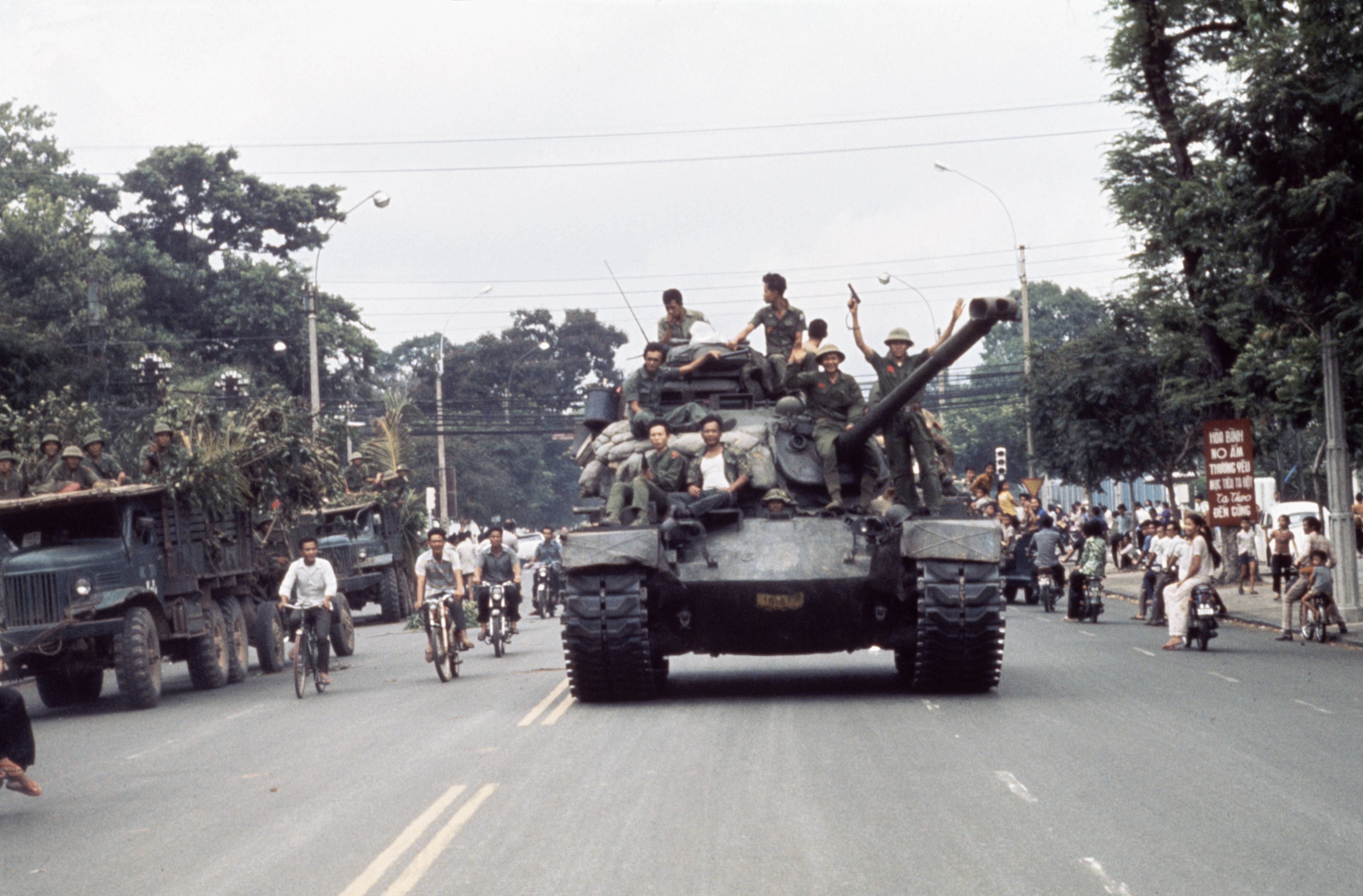 North Vietnamese troops enter Saigon on tanks and trucks, ending the Vietnam War. (Photo by © Jacques Pavlovsky/Sygma/CORBIS/Sygma via Getty Images)