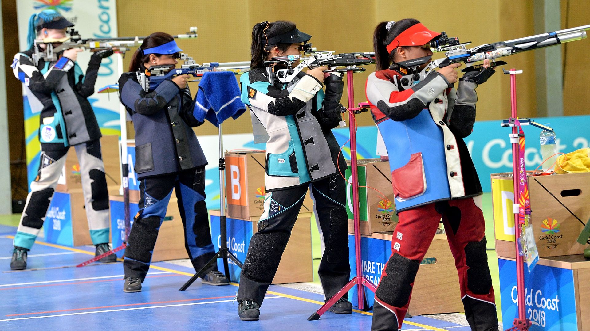 Competitors at a gun range