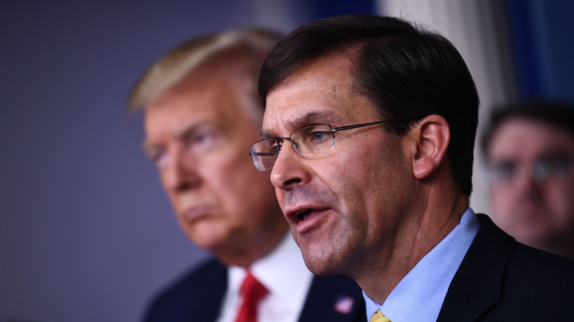 In this image, Mark Esper and Donald Trump stand in the White House