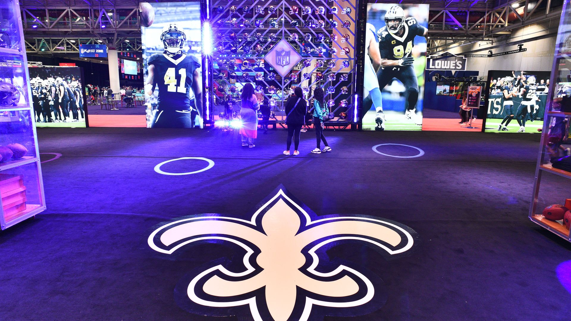 Image shows a fleur de lis on the carpet.