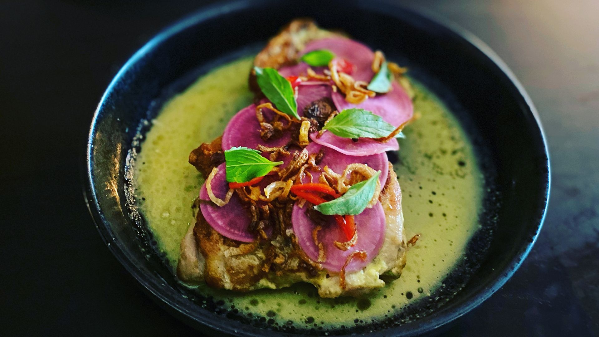Crispy chicken things with “Tom Kha” vinaigrette, basil and fermented radish at Rooster & the Till in Tampa.