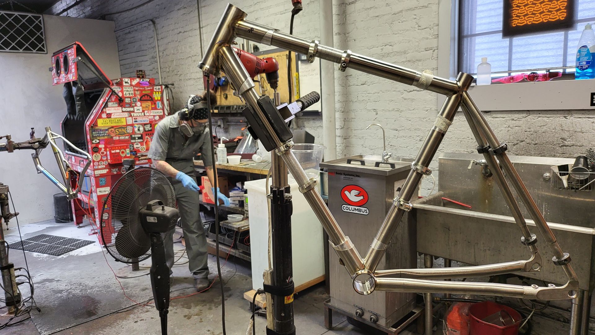 Firefly Bike's Kate Mills adds a design to a premium bike in construction.