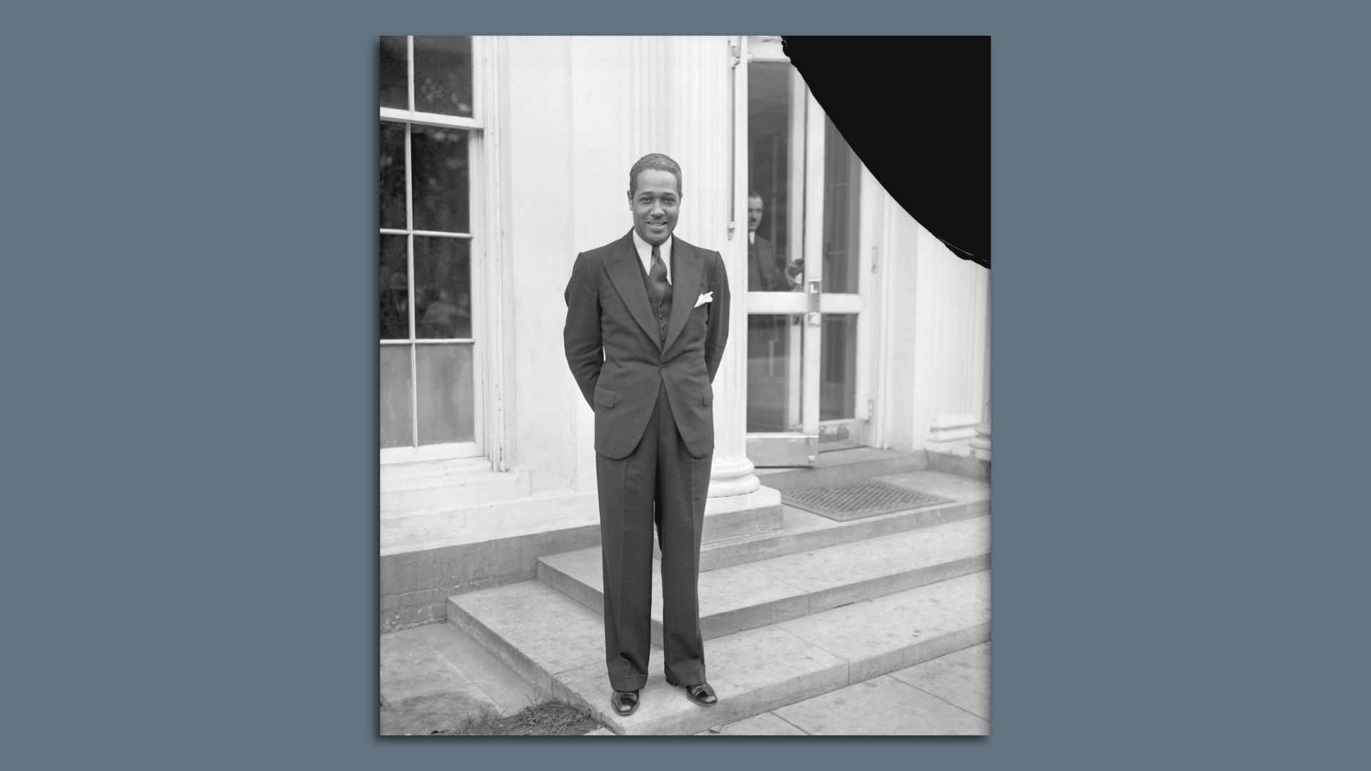 A picture of Duke Ellington posing outside the White House