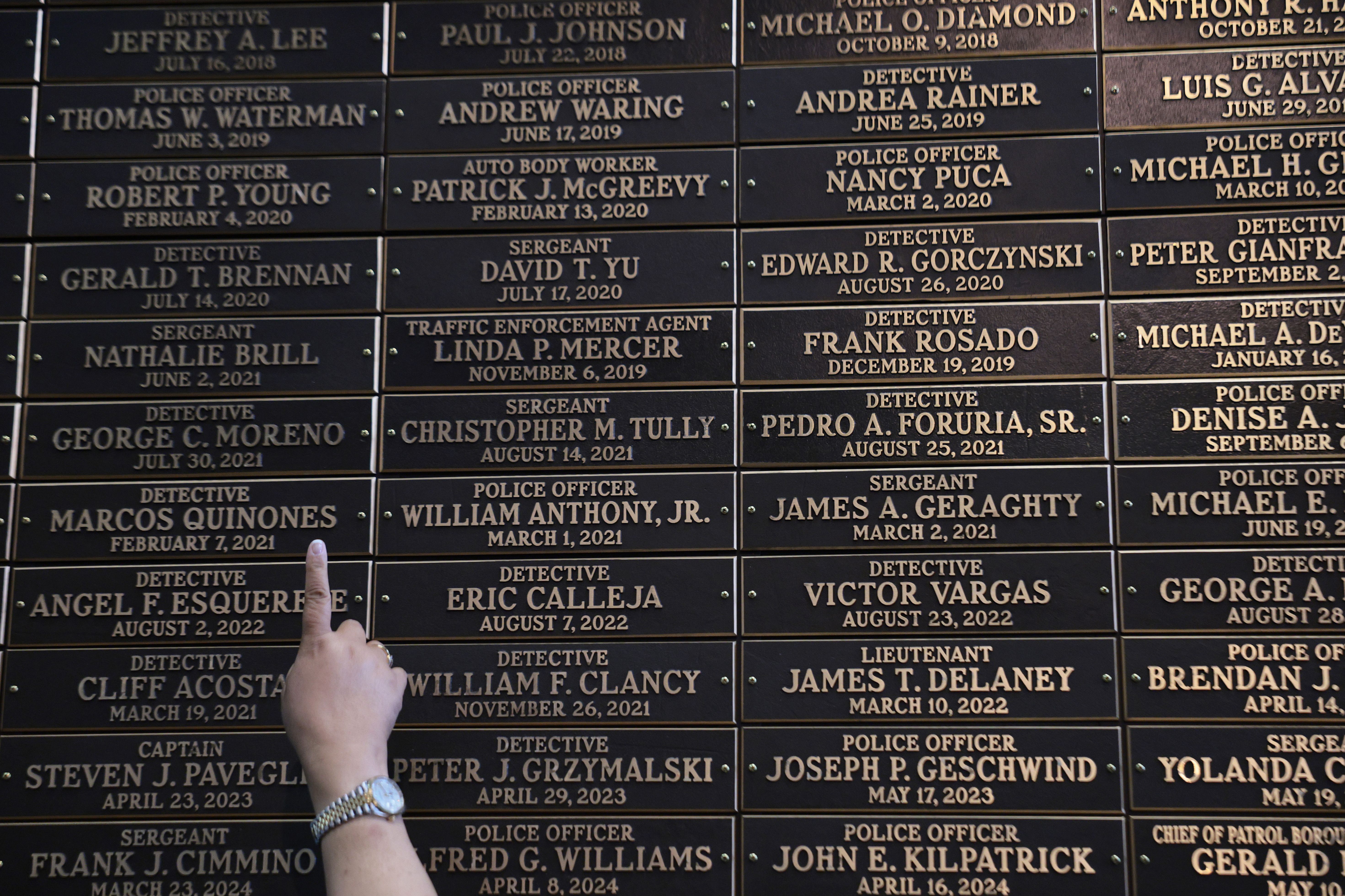 Families of first responders view the new 9/11 Memorial Wall at One Police Plaza in New York City yesterday. Photo: Michael M. Santiago/Getty Images