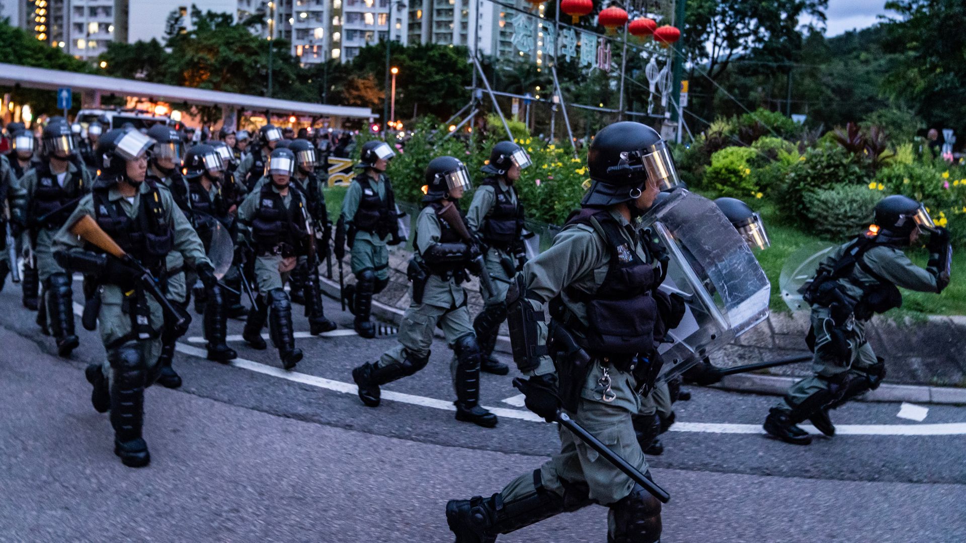 Police charge in Tung Chung district after protesters block the transport routes to the Hong Kong International Airport