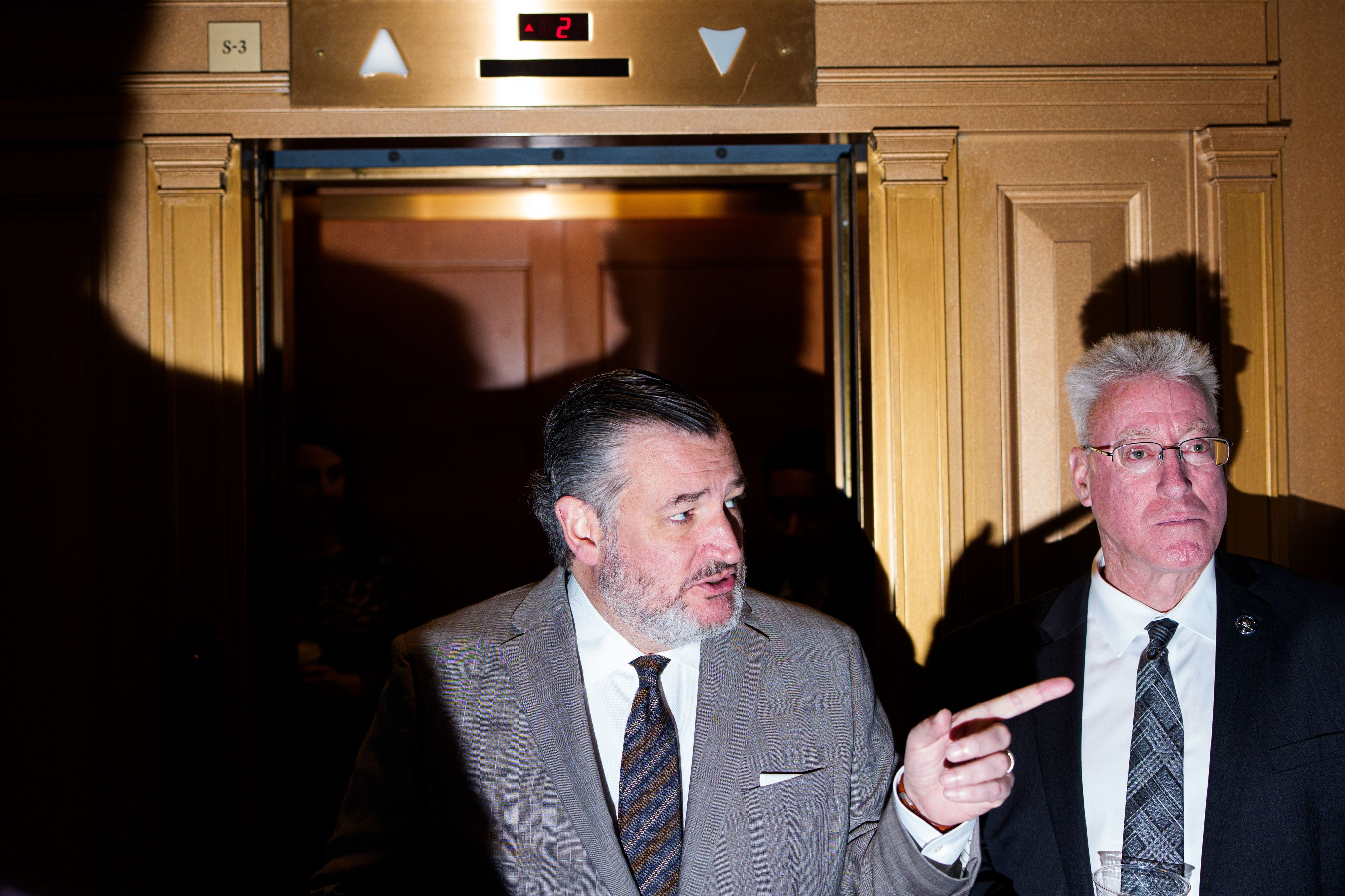 Sen. Ted Cruz stands outside the Senate chamber after a vote to reopen the government last week.