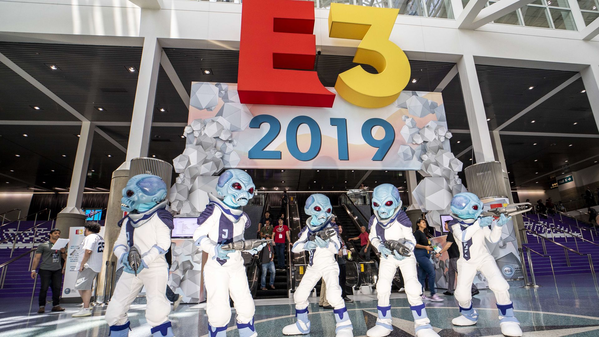 Photo of people dressed as alien costumes while promoting a new video game at the 2019 E3 video game trade show in Los Angeles.