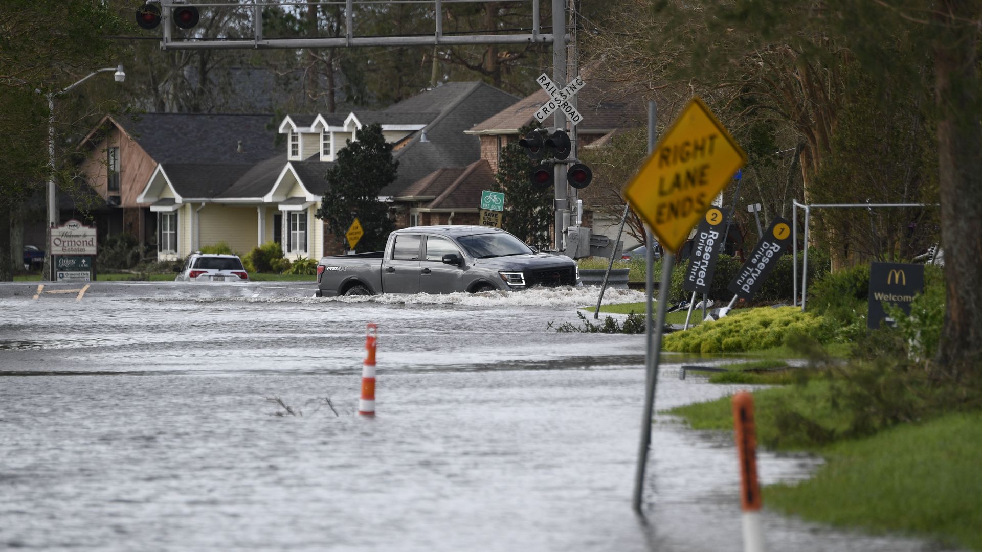 A truck drives through high water near Highway 61 in Destrehan, Louisiana. 