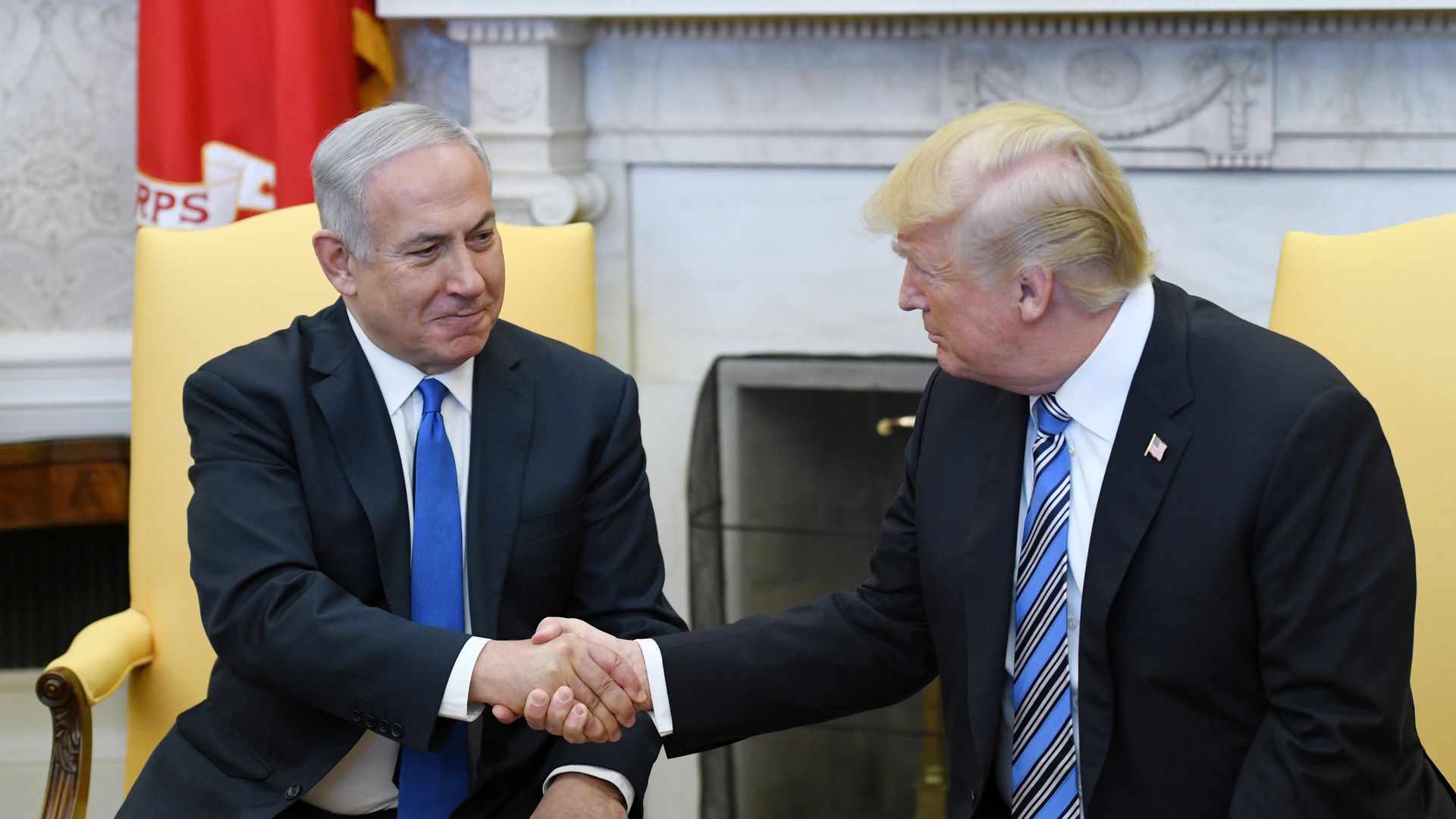 Trump shaking hands with Benjamin Netanyahu