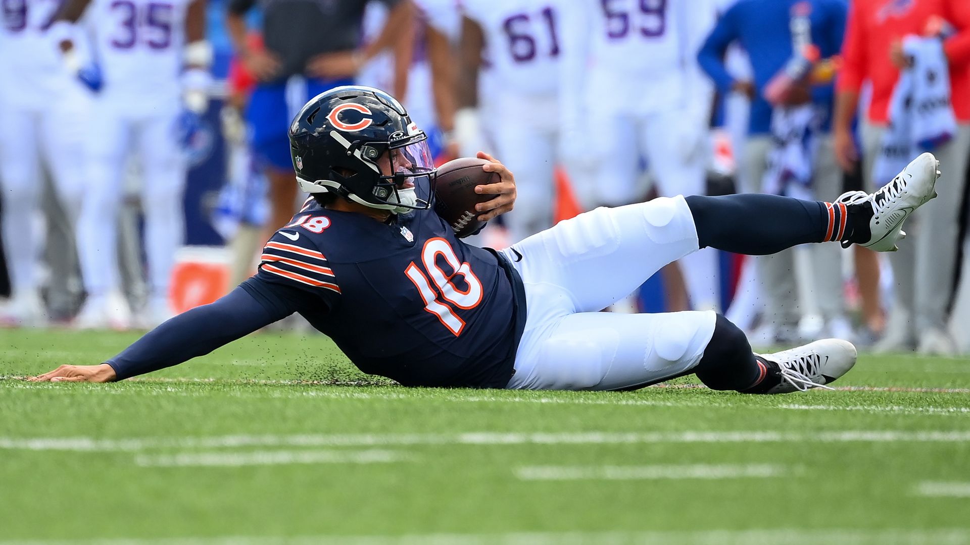 Photo of a football player sliding 